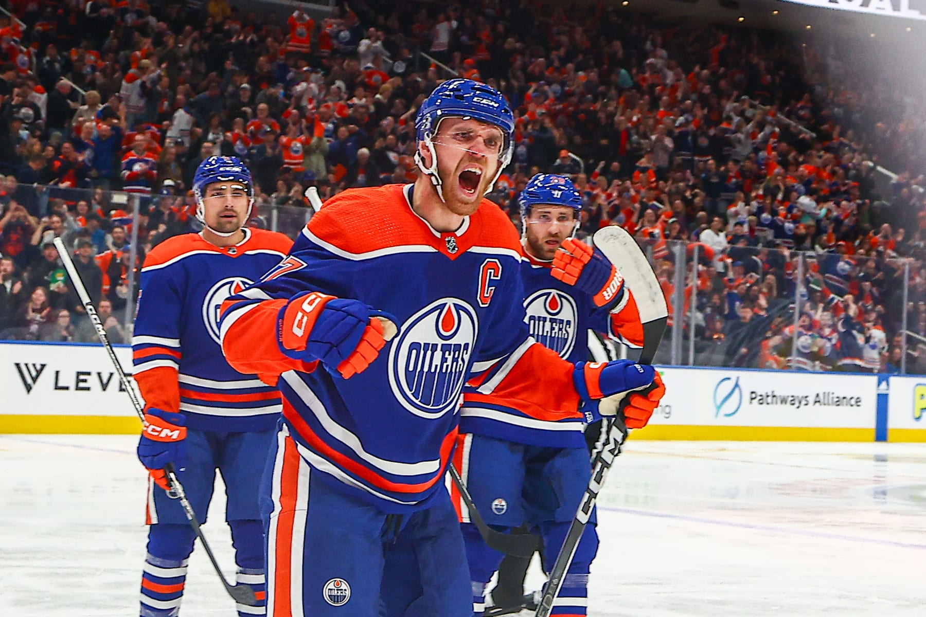 EDMONTON, AB - OCTOBER 21: Edmonton Oilers Center Connor McDavid (97) celebrates a goal scored by Edmonton Oilers Defenceman Darnell Nurse (25) in the first period of the Edmonton Oilers game versus the Winnipeg Jets on October 21, 2023 at Rogers Place in Edmonton, AB. (Photo by Curtis Comeau/Icon Sportswire via Getty Images)
