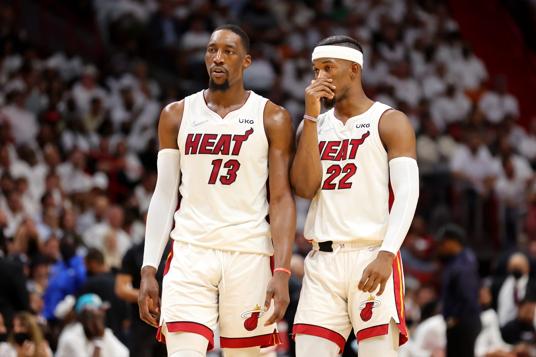 MIAMI, FLORIDA - MAY 19: Bam Adebayo #13 and Jimmy Butler #22 of the Miami Heat talk during the second quarter against the Boston Celtics in Game Two of the 2022 NBA Playoffs Eastern Conference Finals at FTX Arena on May 19, 2022 in Miami, Florida. NOTE TO USER: User expressly acknowledges and agrees that, by downloading and or using this photograph, User is consenting to the terms and conditions of the Getty Images License Agreement. (Photo by Michael Reaves/Getty Images)