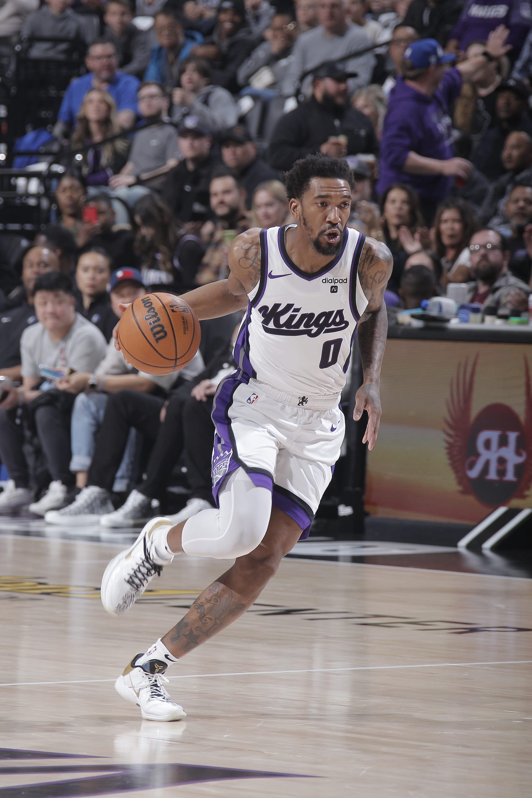 SACRAMENTO, CA - MARCH 29: Malik Monk #0 of the Sacramento Kings brings the ball up the court during the game against the Dallas Mavericks on March 29, 2024 at Golden 1 Center in Sacramento, California. NOTE TO USER: User expressly acknowledges and agrees that, by downloading and or using this photograph, User is consenting to the terms and conditions of the Getty Images Agreement. Mandatory Copyright Notice: Copyright 2024 NBAE (Photo by Rocky Widner/NBAE via Getty Images)