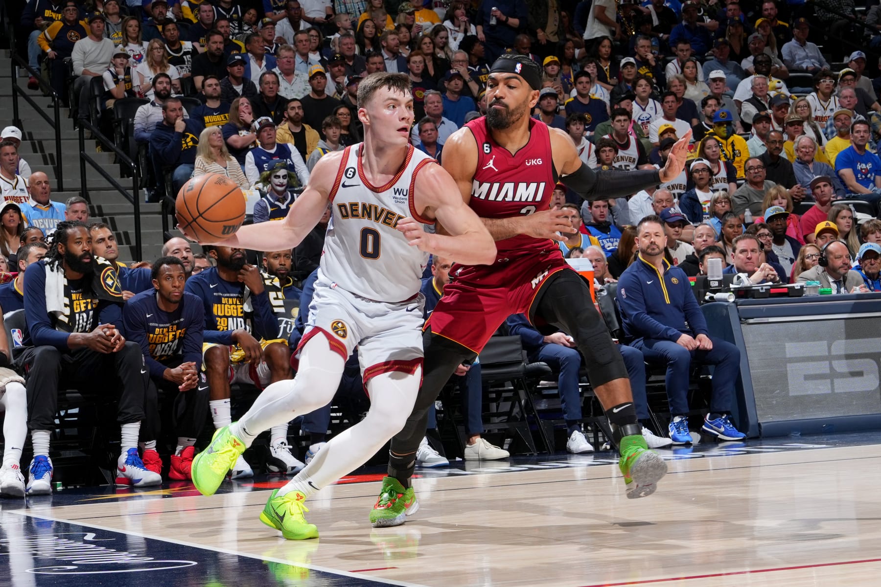 DENVER, CO - JUNE 12: Christian Braun #0 of the Denver Nuggets dribbles the ball during Game Five of the 2023 NBA Finals on June 12, 2023 at Ball Arena in Denver, Colorado. NOTE TO USER: User expressly acknowledges and agrees that, by downloading and or using this Photograph, user is consenting to the terms and conditions of the Getty Images License Agreement. Mandatory Copyright Notice: Copyright 2023 NBAE (Photo by Jesse D. Garrabrant/NBAE via Getty Images)