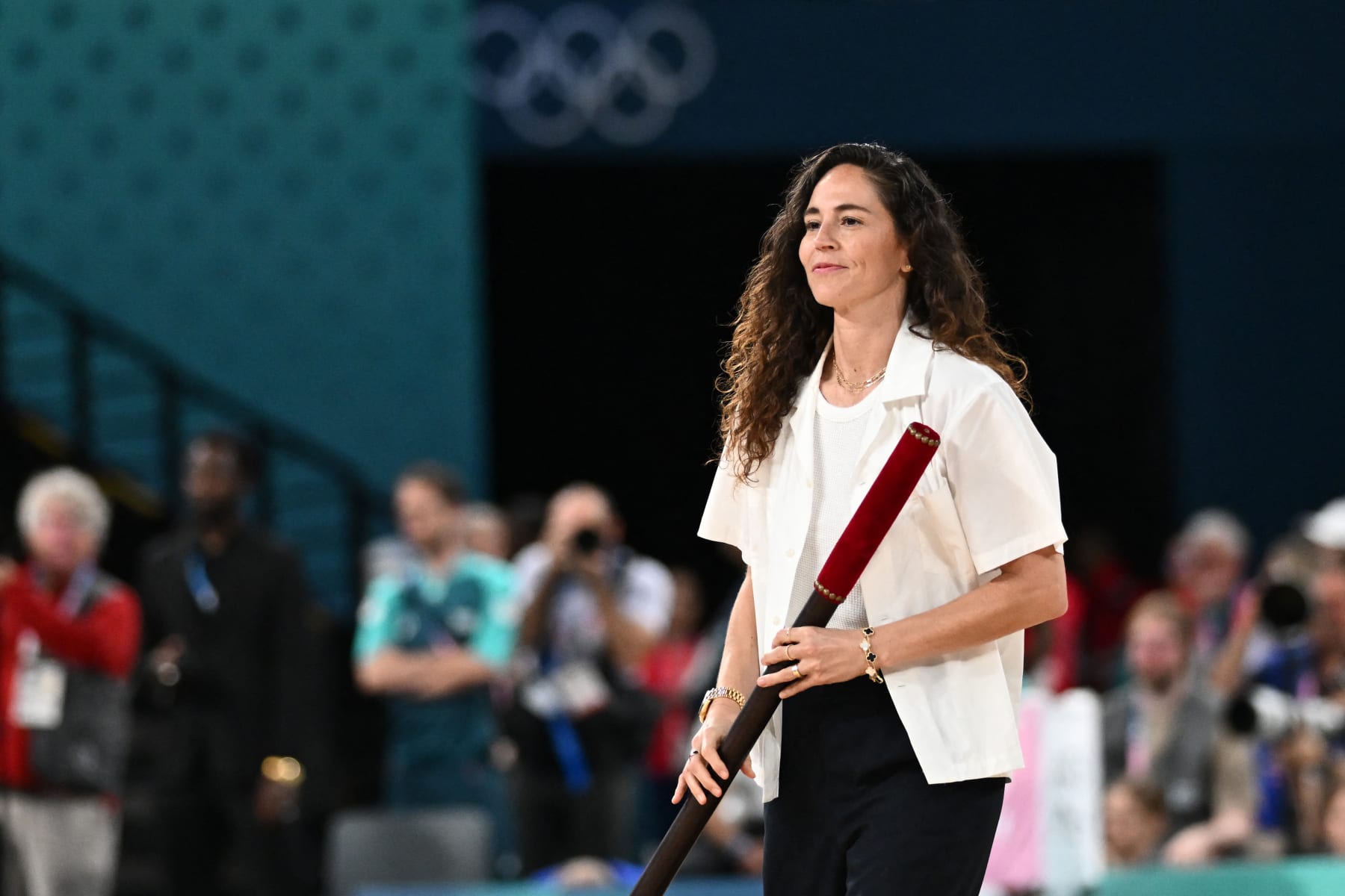 US basketball player Sue Bird opens the session in the women's Gold Medal basketball match between France and the USA during the Paris 2024 Olympic Games at the Bercy  Arena in Paris on August 11, 2024. (Photo by Aris MESSINIS / AFP) (Photo by ARIS MESSINIS/AFP via Getty Images)
