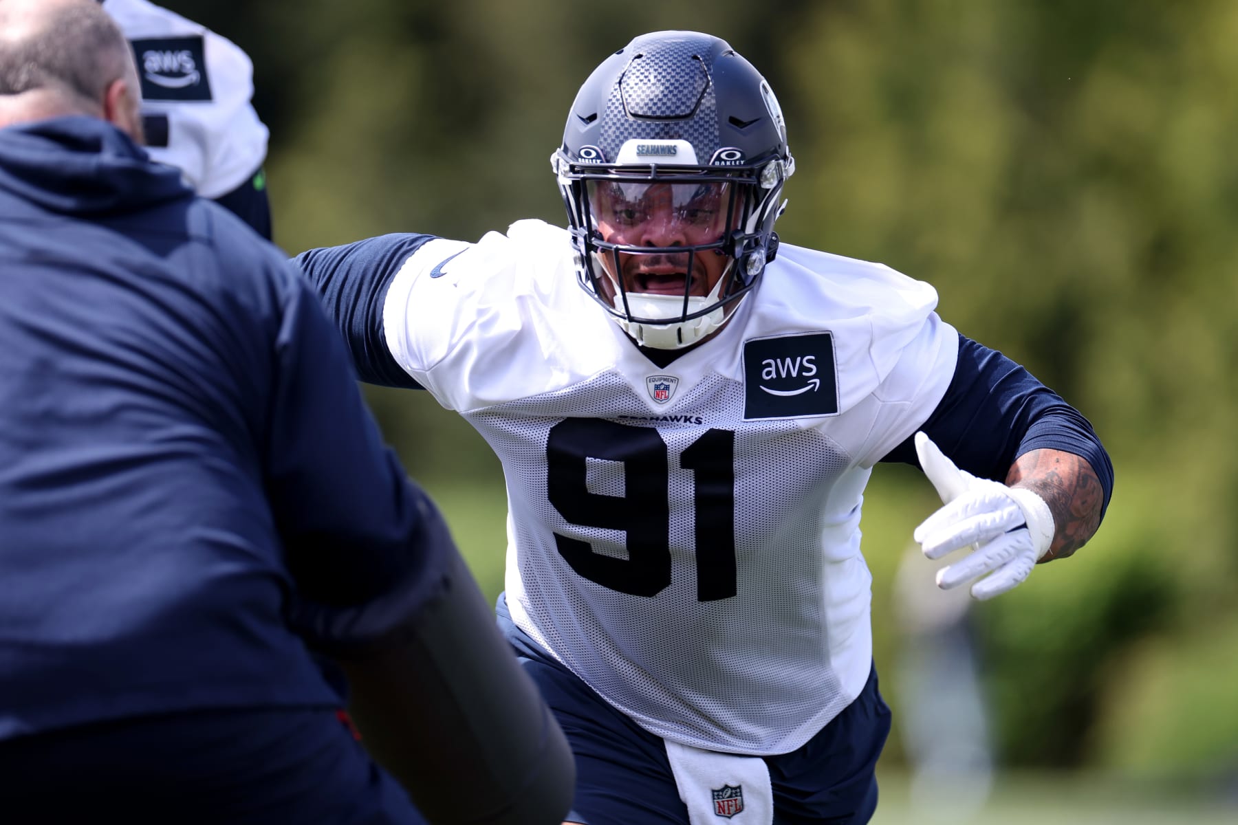 RENTON, WASHINGTON - MAY 03: Byron Murphy II #91 of the Seattle Seahawks works out during Seattle Seahawks rookie minicamp at Virginia Mason Athletic Center on May 03, 2024 in Renton, Washington.  (Photo by Steph Chambers/Getty Images)