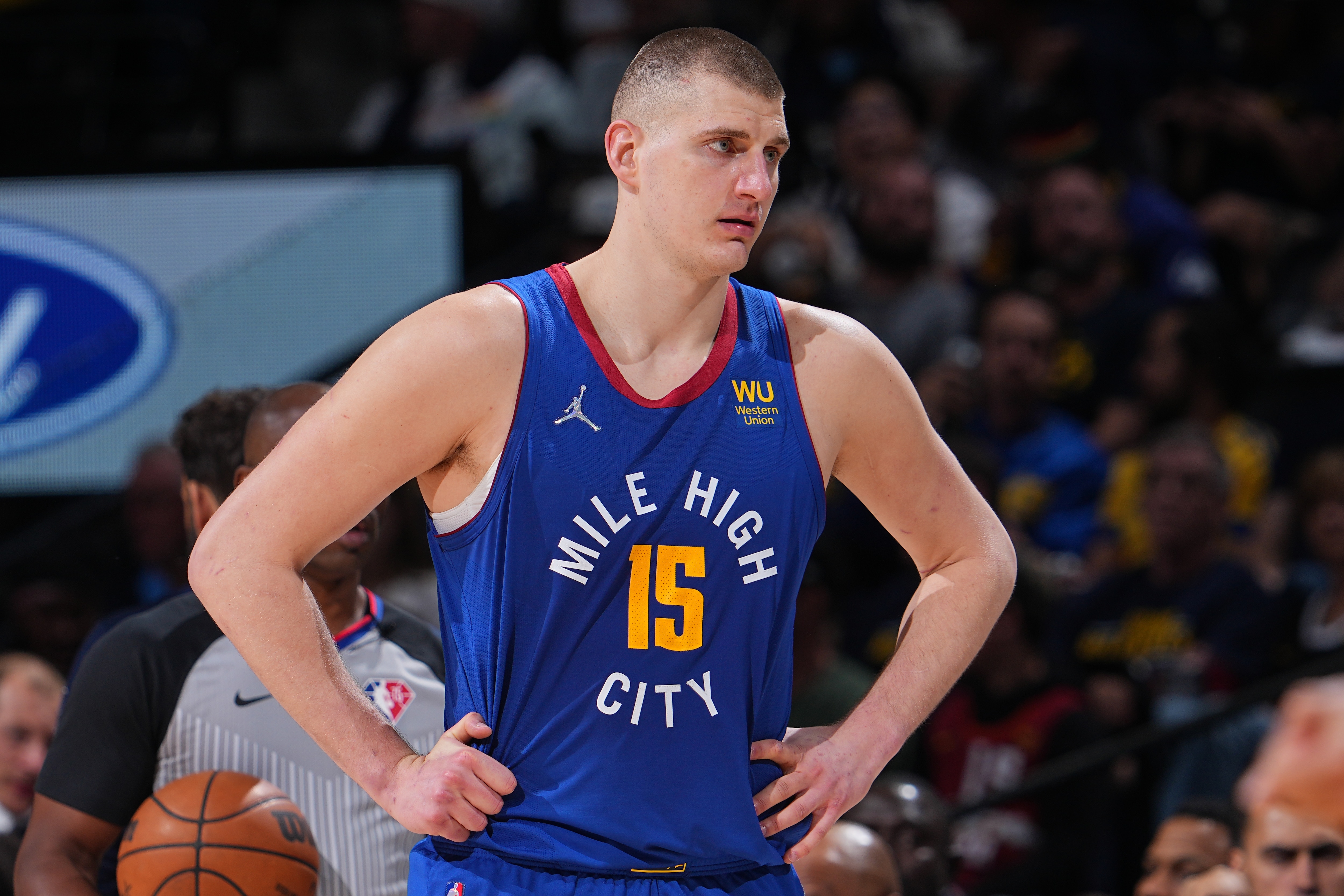 DENVER, CO - APRIL 21: Nikola Jokic #15 of the Denver Nuggets looks on during the game against the Golden State Warriors during Round 1 Game 3 of the 2022 NBA Playoffs on April 21, 2022 at the Ball Arena in Denver, Colorado. NOTE TO USER: User expressly acknowledges and agrees that, by downloading and/or using this Photograph, user is consenting to the terms and conditions of the Getty Images License Agreement. Mandatory Copyright Notice: Copyright 2022 NBAE (Photo by Bart Young/NBAE via Getty Images)