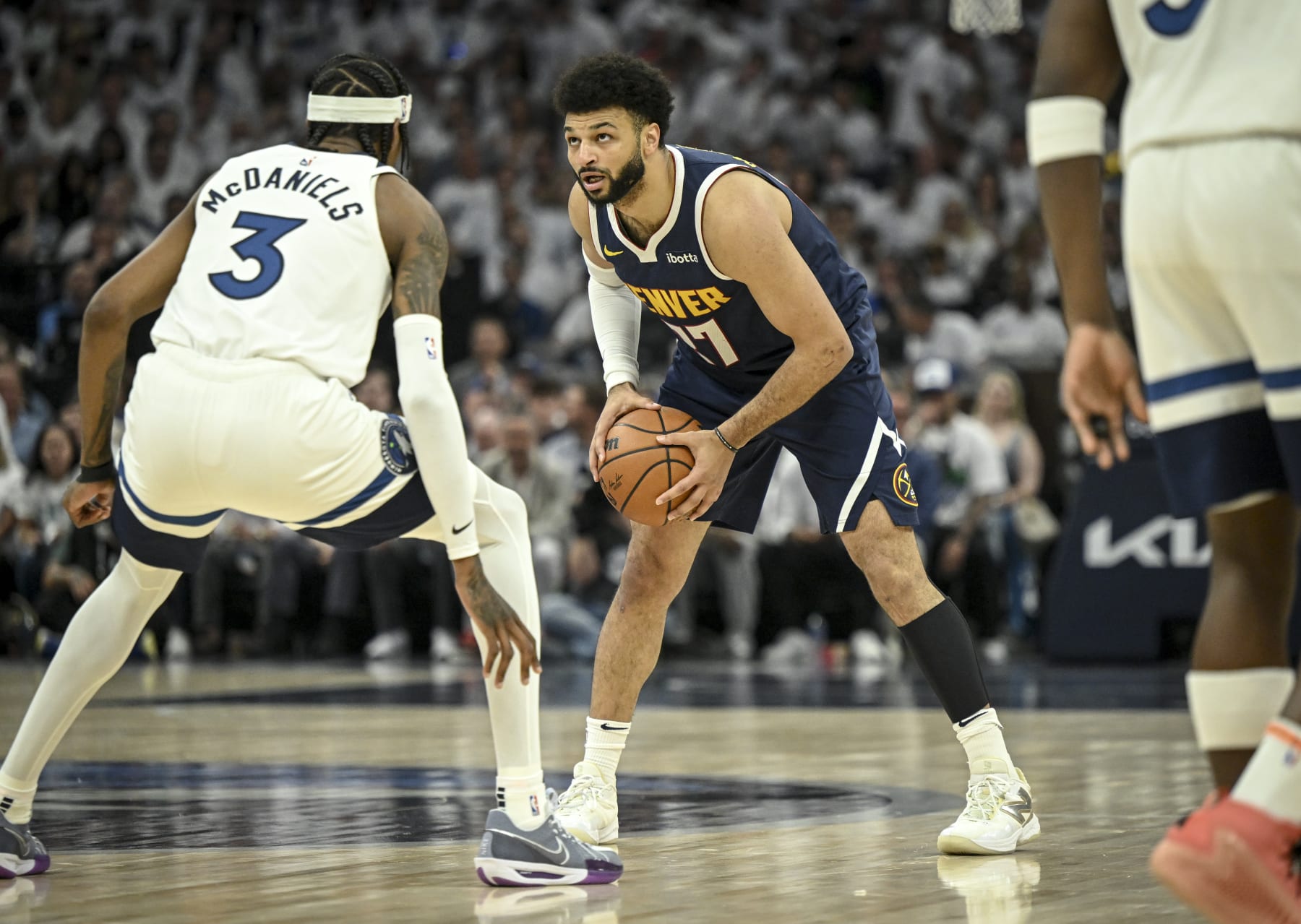 MINNEAPOLIS , MN - MAY 12: Jamal Murray (27) of the Denver Nuggets sizes up Jaden McDaniels (3) of the Minnesota Timberwolves during the first quarter at Target Center in Minneapolis, Minnesota on Sunday, May 12, 2024. (Photo by AAron Ontiveroz/The Denver Post)