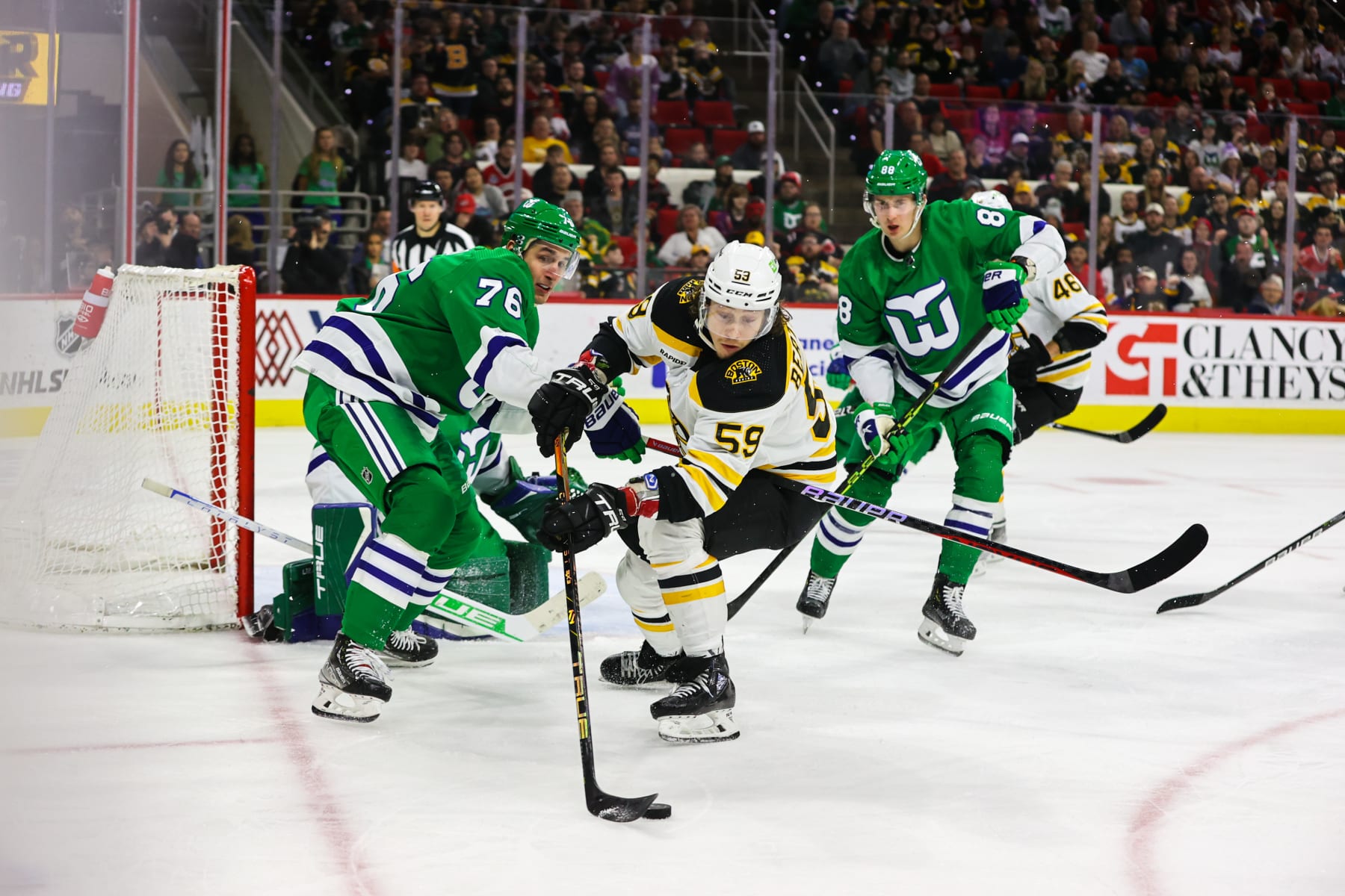 RALEIGH, NC - MARCH 26: Tyler Bertuzzi #59 of the Boston Bruins stops the puck during the third period of the game against the Carolina Hurricanes at PNC Arena on March 26, 2023 in Raleigh, North Carolina. Bruins defeat Hurricanes 4-3. (Photo by Jaylynn Nash/Getty Images)