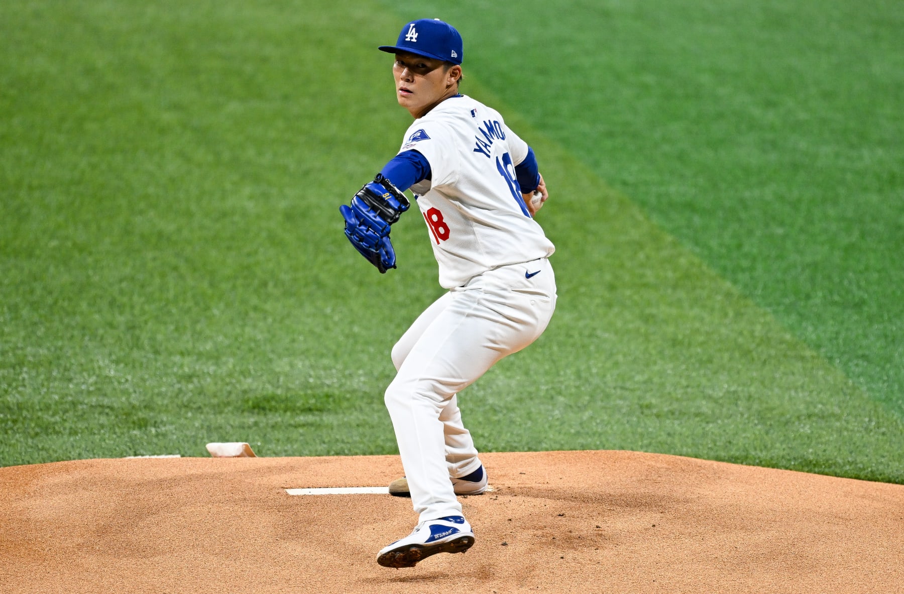 SEOUL, SOUTH KOREA - MARCH 21: Yoshinobu Yamamoto #18 of Los Angeles Dodgers pitches in the top of the first inning during the 2024 Seoul Series game between Los Angeles Dodgers and San Diego Padres at Gocheok Sky Dome on March 21, 2024 in Seoul, South Korea. (Photo by Gene Wang/Getty Images)