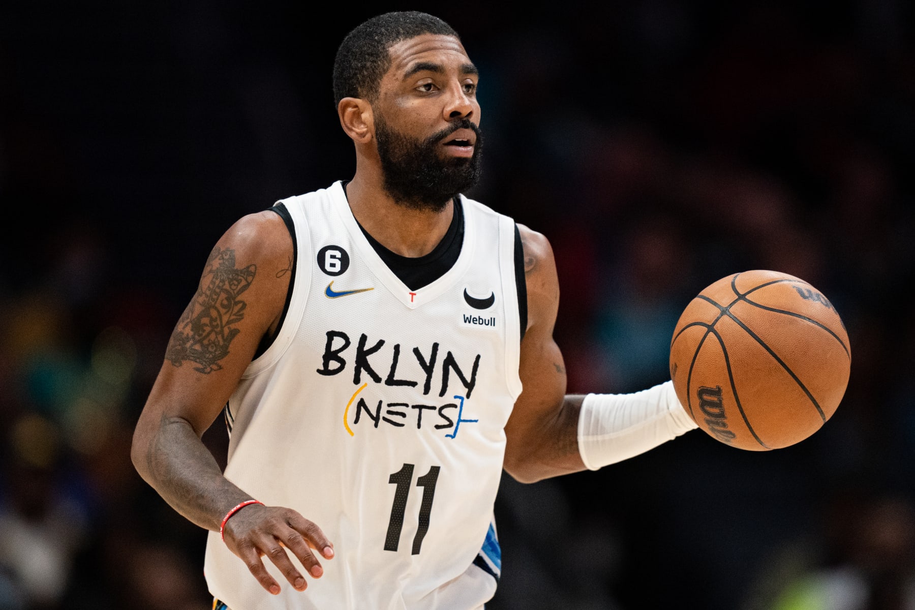 CHARLOTTE, NORTH CAROLINA - DECEMBER 31: Kyrie Irving #11 of the Brooklyn Nets brings the ball up court against the Charlotte Hornets during their game at Spectrum Center on December 31, 2022 in Charlotte, North Carolina. NOTE TO USER: User expressly acknowledges and agrees that, by downloading and or using this photograph, User is consenting to the terms and conditions of the Getty Images License Agreement. (Photo by Jacob Kupferman/Getty Images)