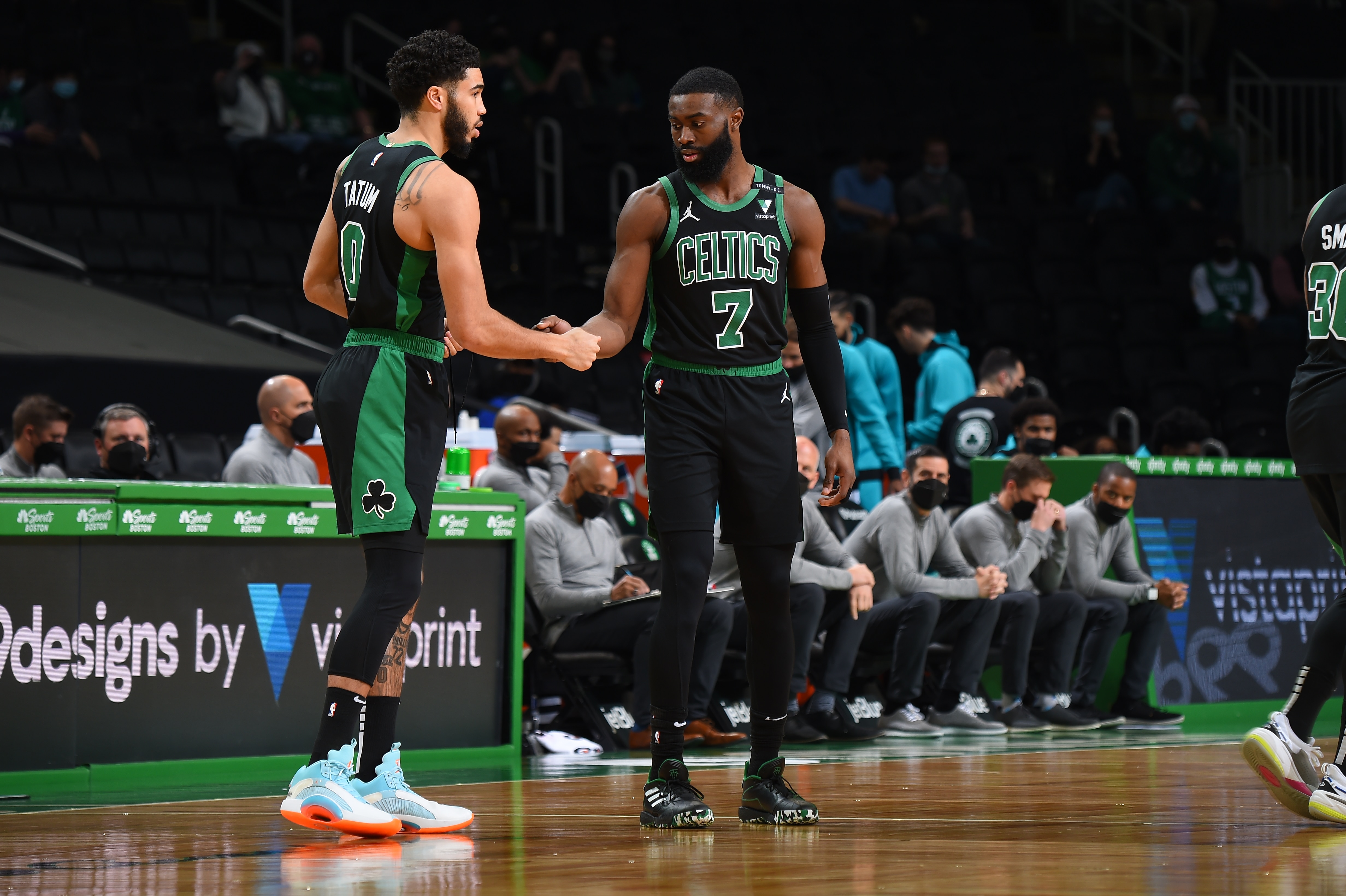 BOSTON, MA - APRIL 4: Jayson Tatum #0 of the Boston Celtics high fives Jaylen Brown #7 of the Boston Celtics during the game against the Charlotte Hornets on April 4, 2021 at the TD Garden in Boston, Massachusetts.  NOTE TO USER: User expressly acknowledges and agrees that, by downloading and or using this photograph, User is consenting to the terms and conditions of the Getty Images License Agreement. Mandatory Copyright Notice: Copyright 2021 NBAE  (Photo by Brian Babineau/NBAE via Getty Images)