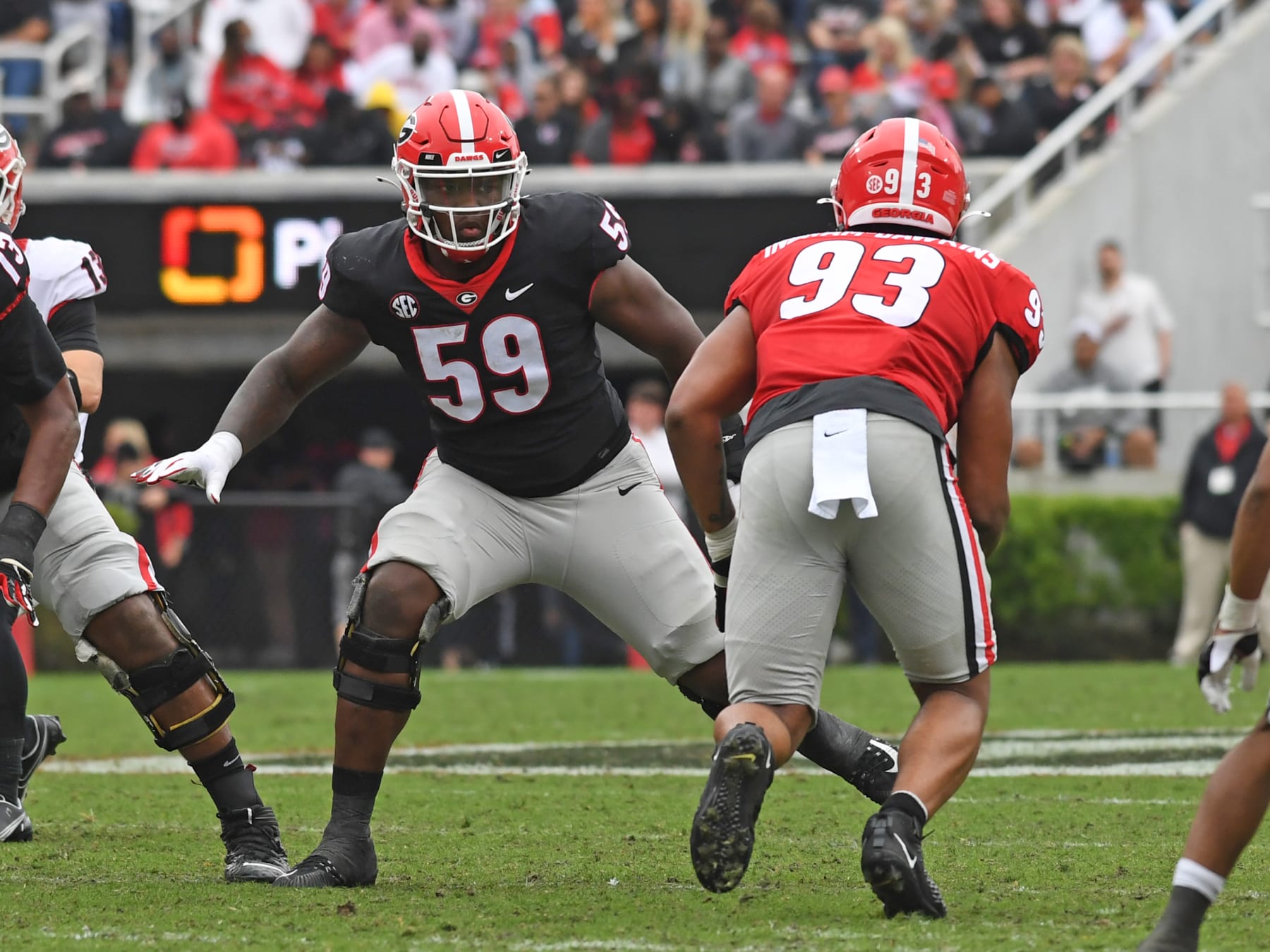 ATHENS, GA - APRIL 16: Georgia Bulldogs Offensive Linemen Broderick Jones (59) blocks Georgia Bulldogs Defensive Linemen Tyrion Ingram-Dawkins (93) during the Georgia Bulldogs G-Day intra-squad spring game on April 16, 2022, at Sanford Stadium in Athens, GA.(Photo by Jeffrey Vest/Icon Sportswire via Getty Images)