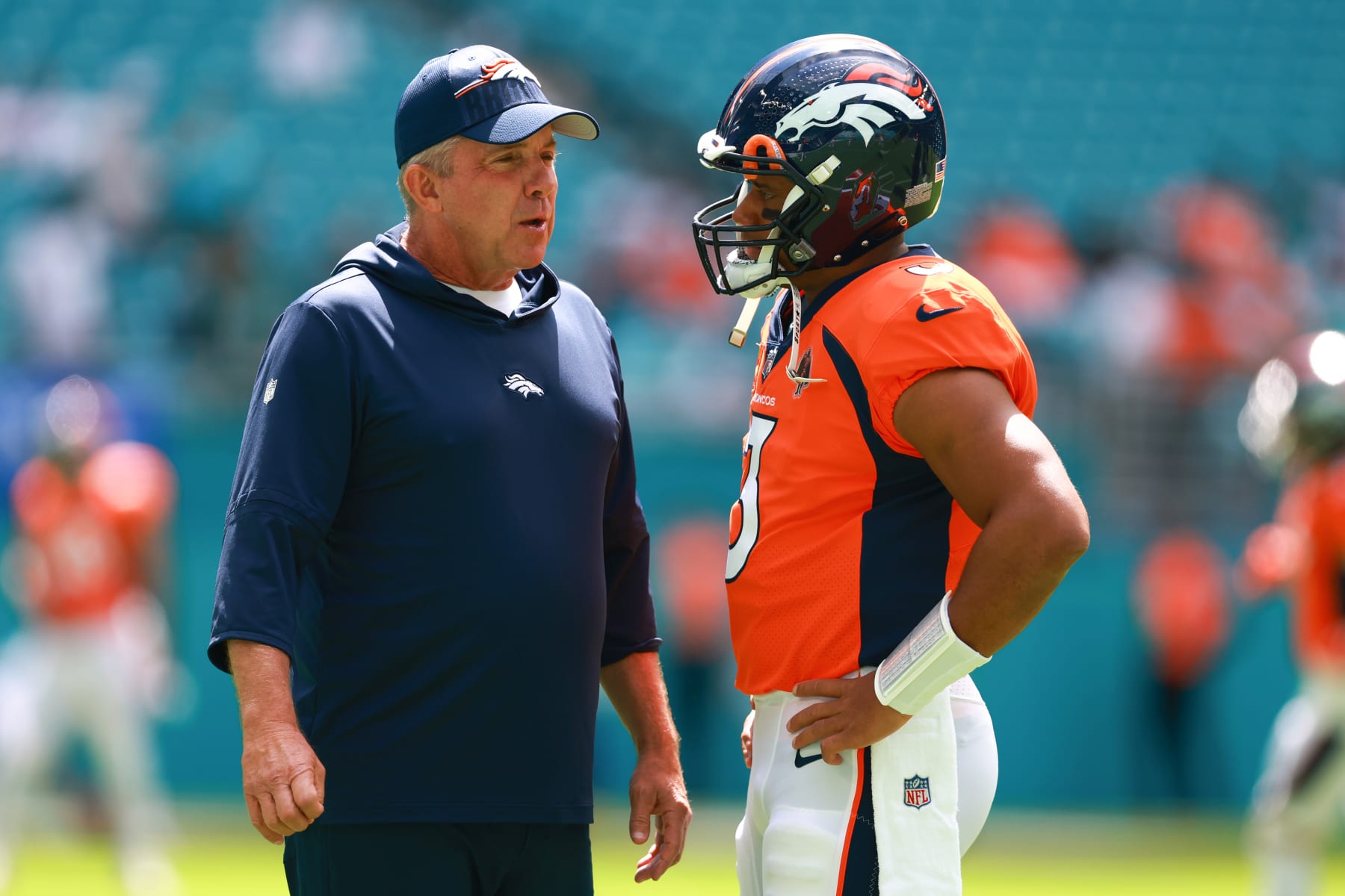 MIAMI GARDENS, FLORIDA - SEPTEMBER 24: Head coach Sean Payton of the Denver Broncos talks to Russell Wilson #3 of the Denver Broncos prior to a game against the Miami Dolphins at Hard Rock Stadium on September 24, 2023 in Miami Gardens, Florida. (Photo by Megan Briggs/Getty Images)