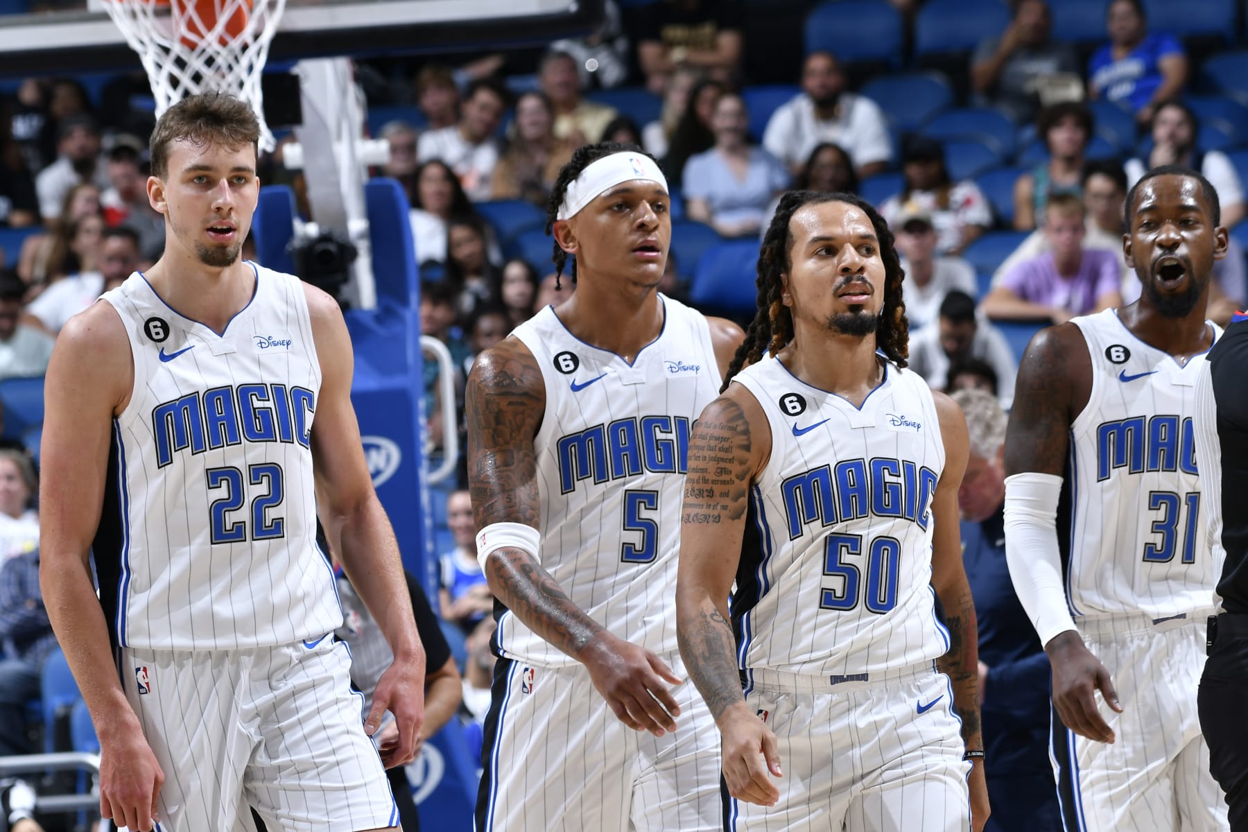 ORLANDO, FL - OCTOBER 11: Franz Wagner #22, Paolo Banchero #5, Cole Anthony #50 and Terrence Ross #31 of the Orlando Magic look on during the game against the Memphis Grizzlies on October 11, 2022 at Amway Center in Orlando, Florida. NOTE TO USER: User expressly acknowledges and agrees that, by downloading and or using this photograph, User is consenting to the terms and conditions of the Getty Images License Agreement. Mandatory Copyright Notice: Copyright 2022 NBAE (Photo by Fernando Medina/NBAE via Getty Images)