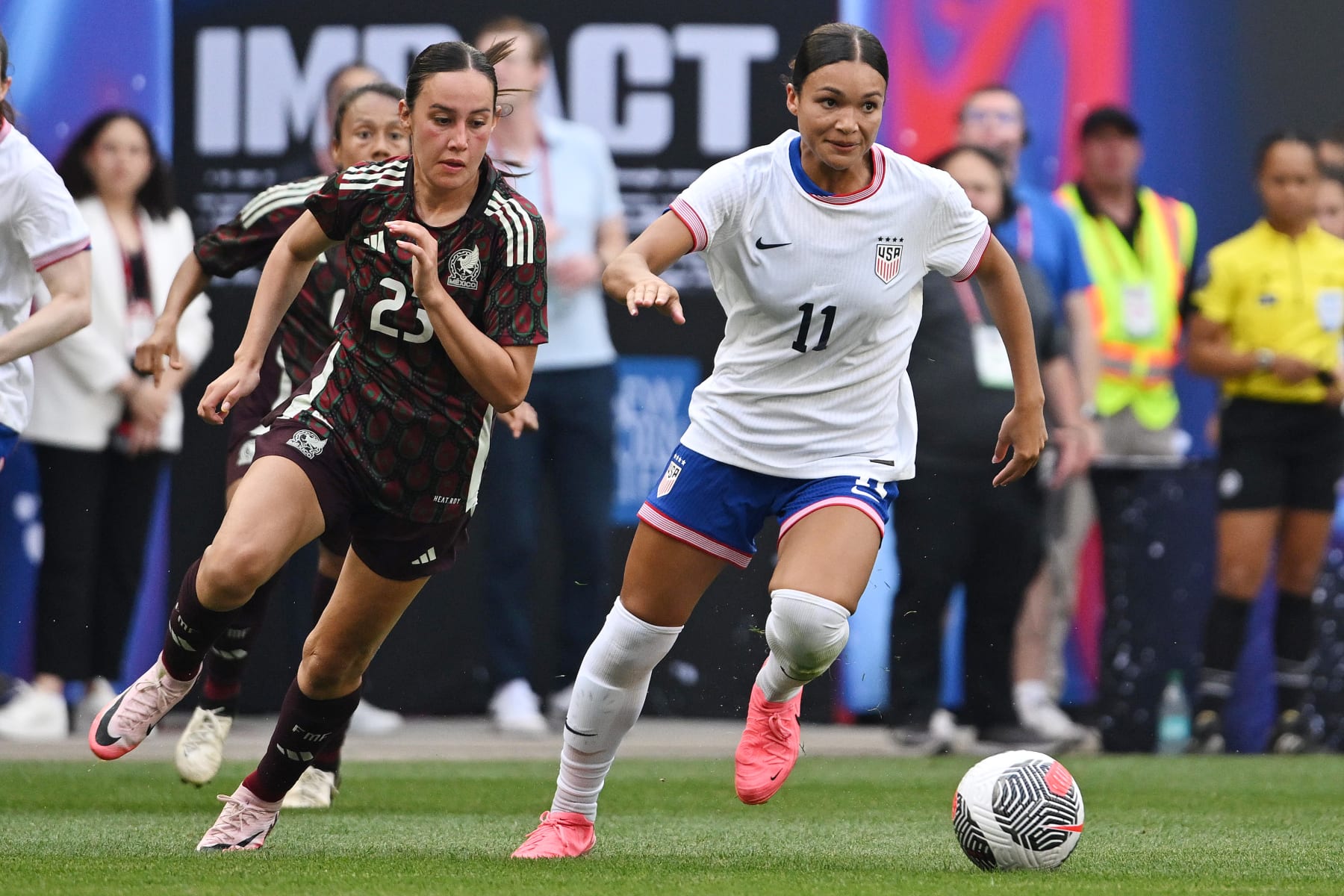 HARRISON, NEW JERSEY - JULY 13:  Sophia Smith #11 of the United States is pursued by Kimberly Rodríguez #23 of Mexico during the second half at Red Bull Arena on July 13, 2024 in Harrison, New Jersey. (Photo by Howard Smith/ISI Photos/USSF/Getty Images for USSF)