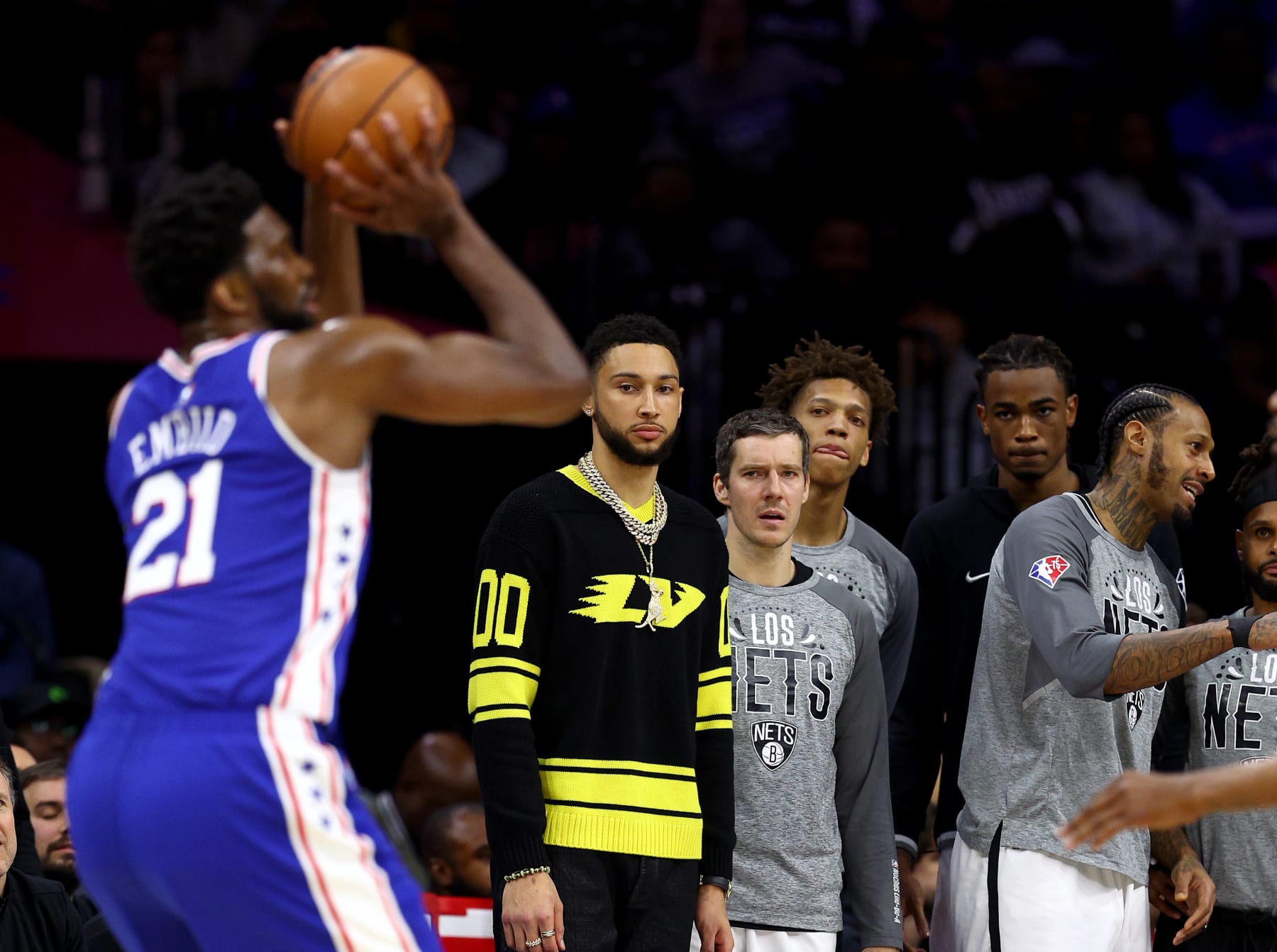 PHILADELPHIA, PENNSYLVANIA - MARCH 10:  Ben Simmons #10 of the Brooklyn Nets watches as former teammate Joel Embiid #21 of the Philadelphia 76ers takes a shot in the second half at Wells Fargo Center on March 10, 2022 in Philadelphia, Pennsylvania. The Brooklyn Nets defeated the Philadelphia 76ers 129-100. NOTE TO USER: User expressly acknowledges and agrees that, by downloading and or using this photograph, User is consenting to the terms and conditions of the Getty Images License Agreement. (Photo by Elsa/Getty Images)