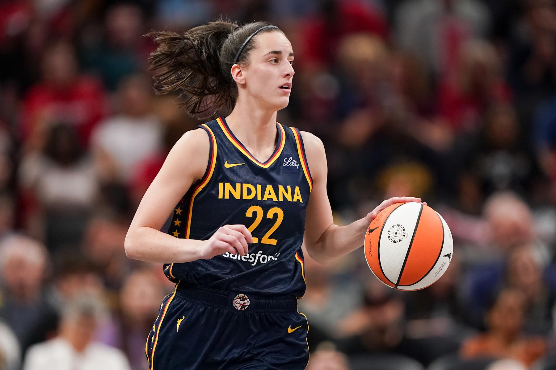 INDIANAPOLIS, INDIANA - SEPTEMBER 04: Caitlin Clark #22 of the Indiana Fever dribbles the ball in the third quarter against the Los Angeles Sparks at Gainbridge Fieldhouse on September 04, 2024 in Indianapolis, Indiana. NOTE TO USER: User expressly acknowledges and agrees that, by downloading and or using this photograph, User is consenting to the terms and conditions of the Getty Images License Agreement. (Photo by Dylan Buell/Getty Images)