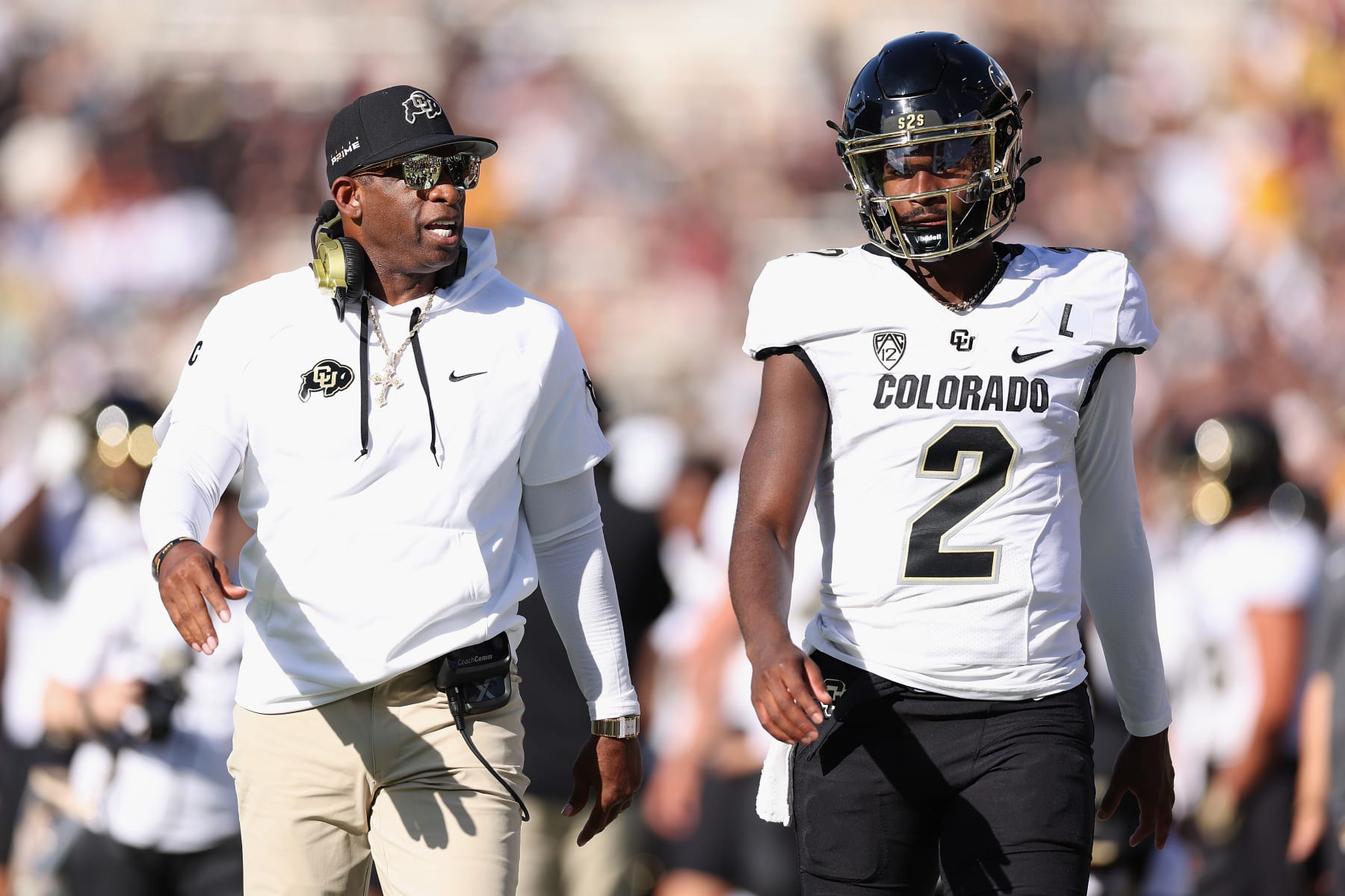 TEMPE, ARIZONA - OCTOBER 07: Head coach Deion Sanders of the Colorado Buffaloes talks with quarterback Shedeur Sanders #2 during first half of the NCAAF game against the Arizona State Sun Devils at Mountain America Stadium on October 07, 2023 in Tempe, Arizona. (Photo by Christian Petersen/Getty Images)