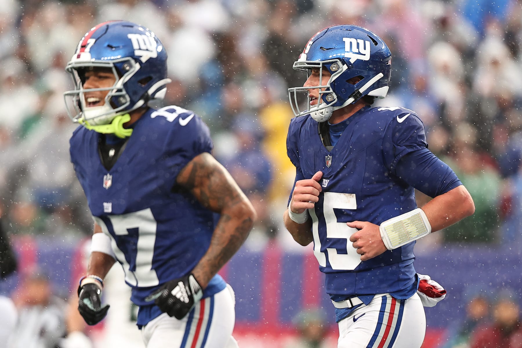 EAST RUTHERFORD, NEW JERSEY - OCTOBER 29: Wan'Dale Robinson #17 of the New York Giants and Tommy DeVito #15 of the New York Giants jog off the field after DeVito's rushing touchdown during the third quarter against the New York Jets at MetLife Stadium on October 29, 2023 in East Rutherford, New Jersey. (Photo by Dustin Satloff/Getty Images)