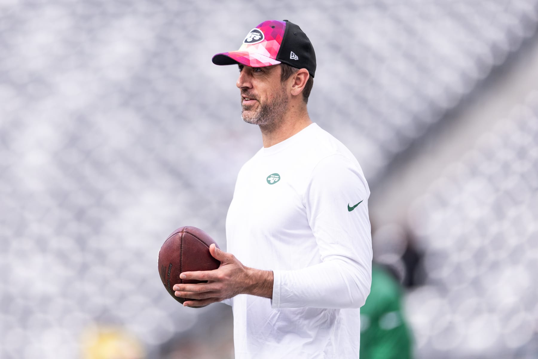 EAST RUTHERFORD, NEW JERSEY - OCTOBER 15: Aaron Rodgers #8 of the New York Jets tosses the ball prior to the game against the Philadelphia Eagles at MetLife Stadium on October 15, 2023 in East Rutherford, New Jersey. (Photo by Dustin Satloff/Getty Images)
