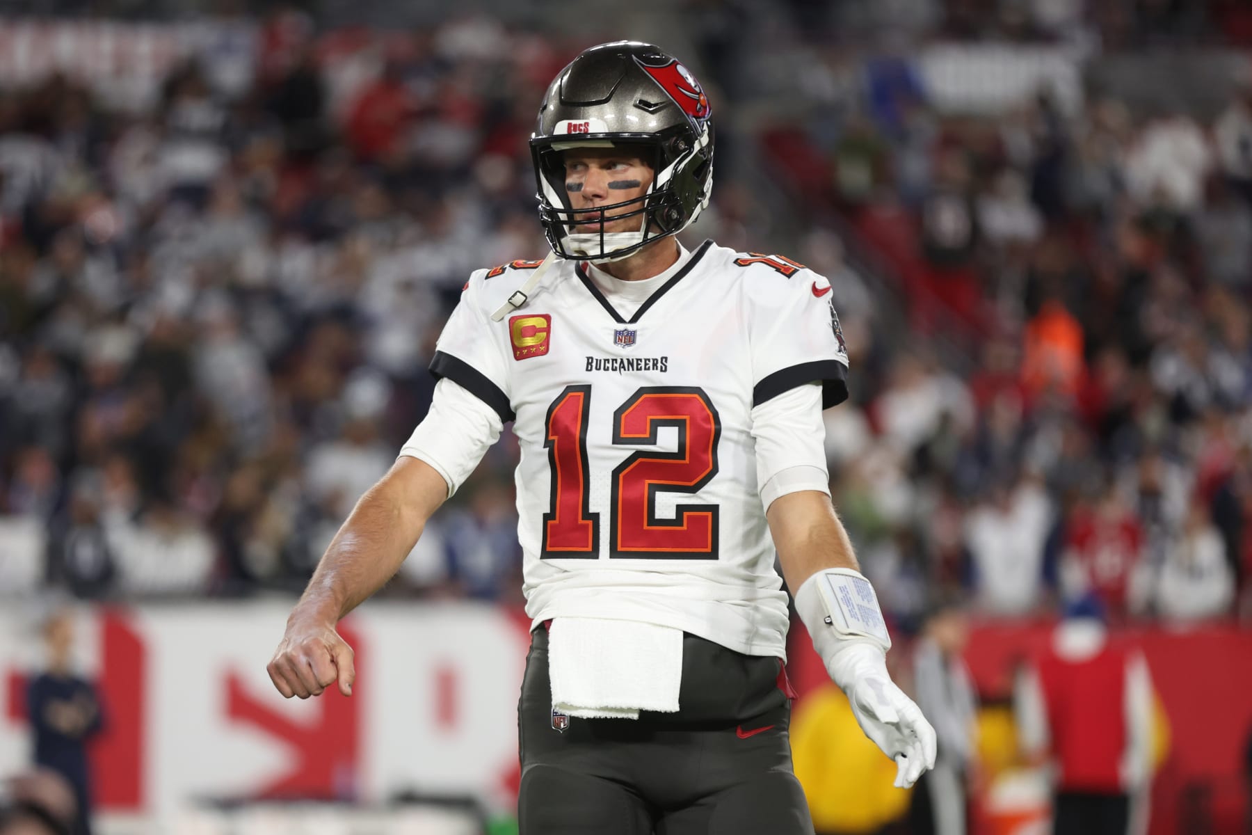 TAMPA, FLORIDA - JANUARY 16: Tom Brady  #12 of the Tampa Bay Buccaneers stands on the field against the Dallas Cowboys prior to the NFC Wild Card Playoff game at Raymond James Stadium on January 16, 2023 in Tampa, Florida. (Perry Knotts/Getty Images)