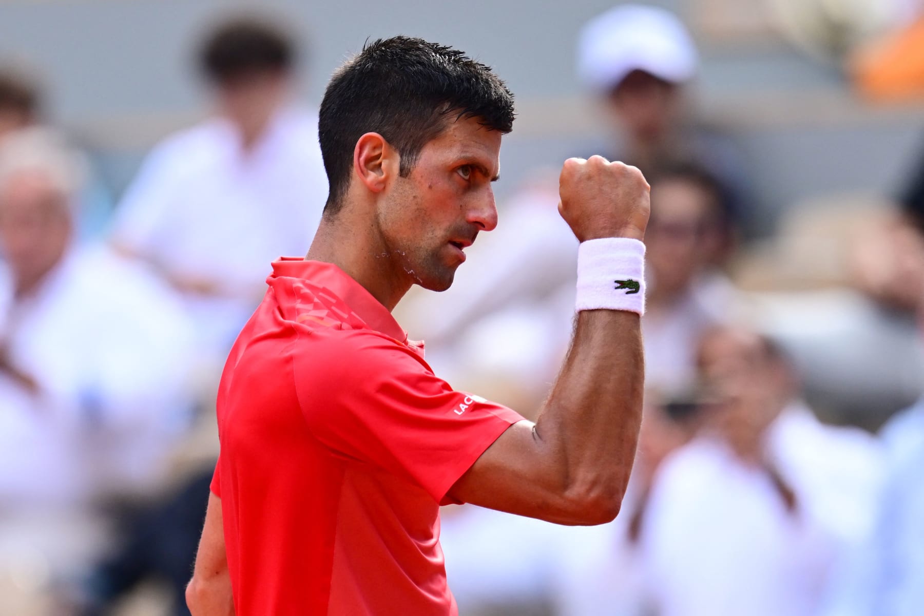 Serbia's Novak Djokovic celebrates winning the second set against Norway's Casper Ruud during their men's singles final match on day fifteen of the Roland-Garros Open tennis tournament at the Court Philippe-Chatrier in Paris on June 11, 2023. (Photo by Emmanuel DUNAND / AFP) (Photo by EMMANUEL DUNAND/AFP via Getty Images)