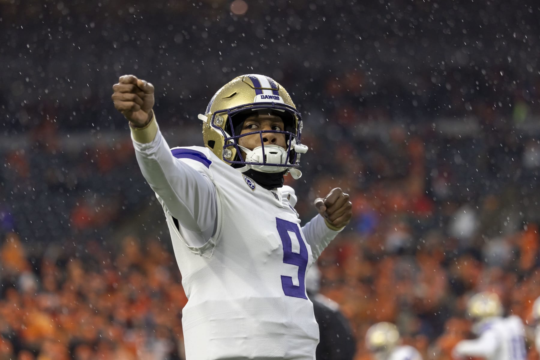 CORVALLIS, OREGON - NOVEMBER 18: Quarterback Michael Penix Jr. #9 of the Washington Huskies simulates  shooting an arrow against the Oregon State Beavers  at Reser Stadium on November 18, 2023 in Corvallis, Oregon. (Photo by Tom Hauck/Getty Images)
