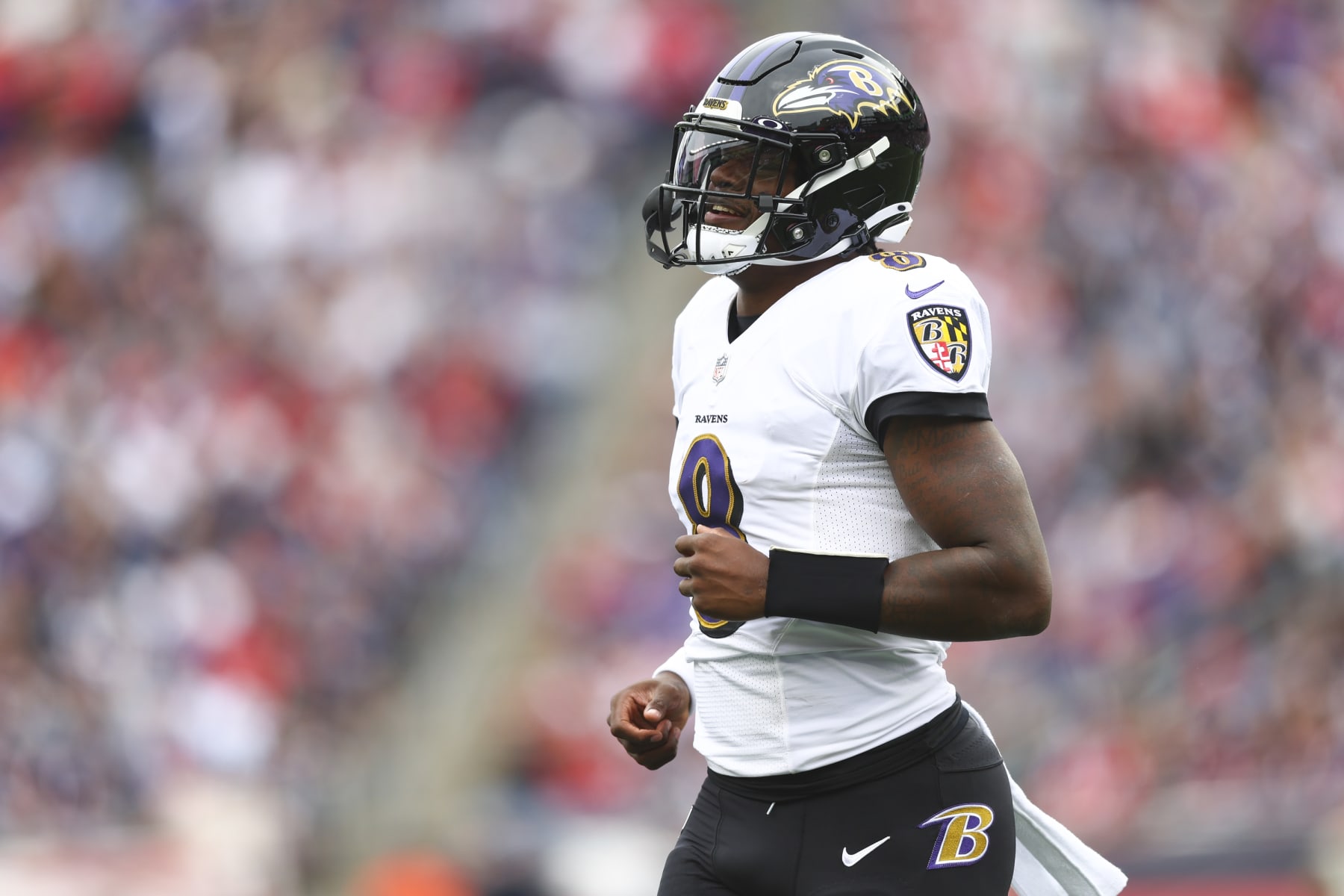 FOXBOROUGH, MASSACHUSETTS - SEPTEMBER 25: Quarterback Lamar Jackson #8 of the Baltimore Ravens looks on during the first half at Gillette Stadium on September 25, 2022 in Foxborough, Massachusetts. (Photo by Adam Glanzman/Getty Images)