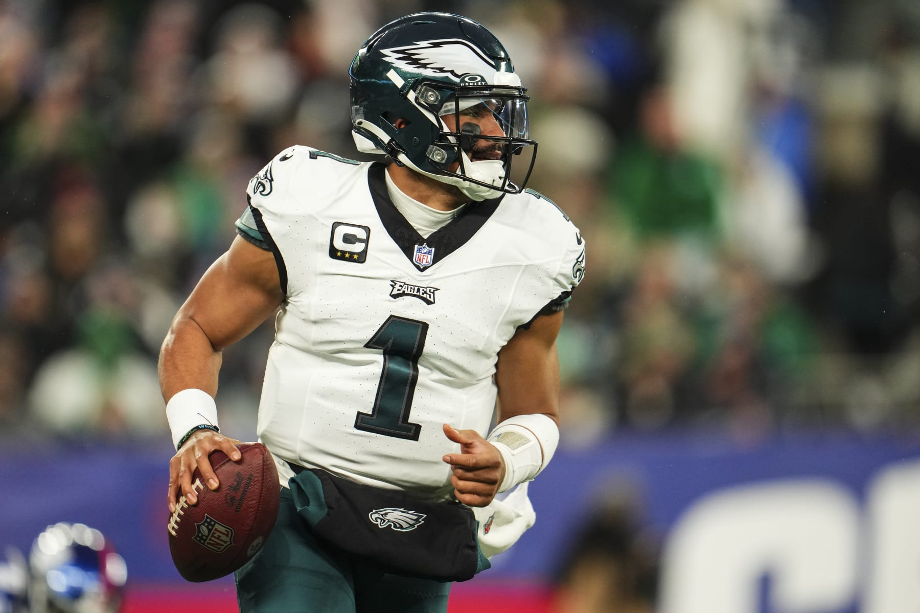EAST RUTHERFORD, NJ - JANUARY 07: Jalen Hurts #1 of the Philadelphia Eagles scrambles out of the pocket during an NFL football game against the New York Giants at MetLife Stadium on January 7, 2024 in East Rutherford, New Jersey. (Photo by Cooper Neill/Getty Images)