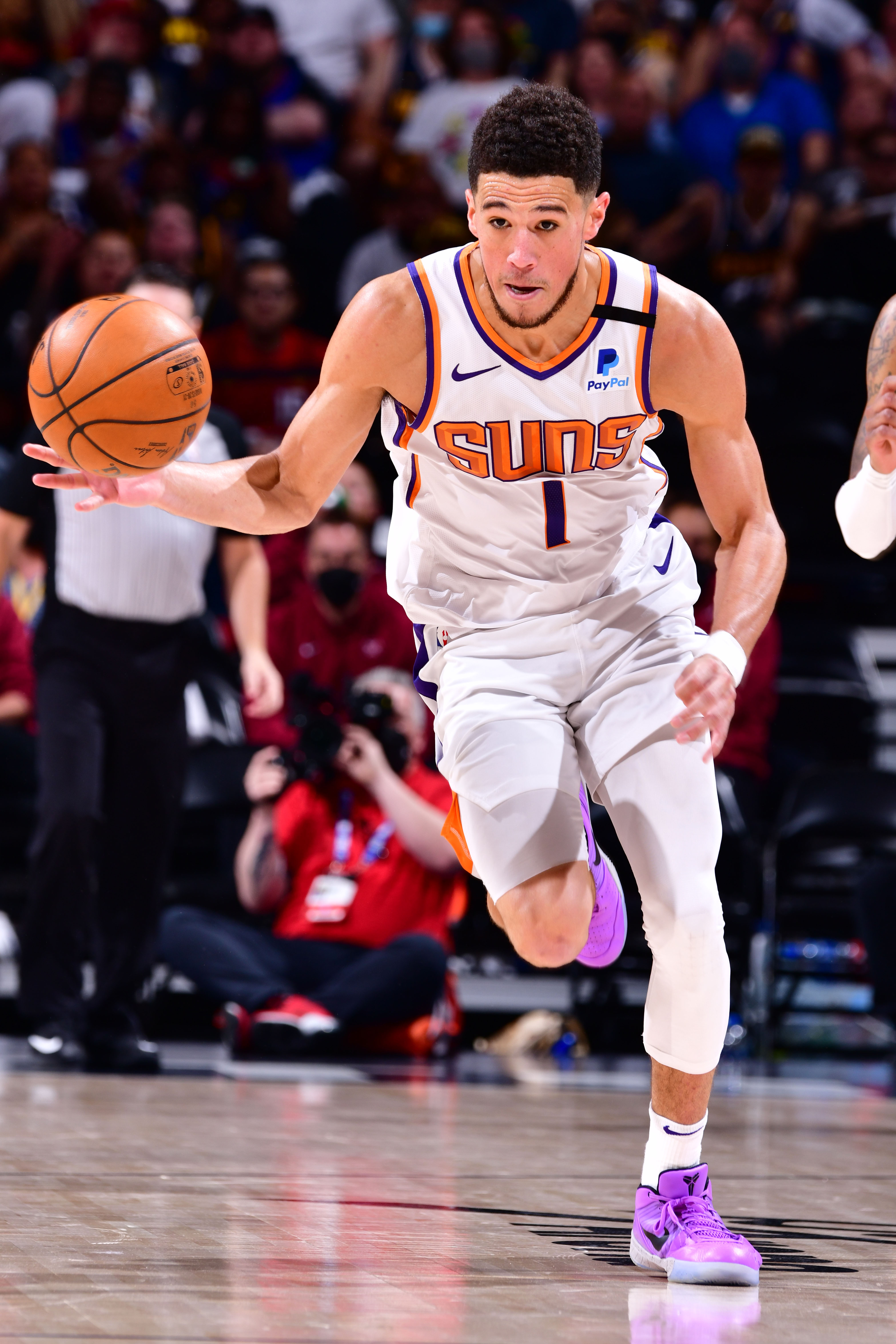 DENVER, CO - JUNE 13: Devin Booker #1 of the Phoenix Suns dribbles the ball during Round 2, Game 4 of the 2021 NBA Playoffs on June 13, 2021 at the Ball Arena in Denver, Colorado. NOTE TO USER: User expressly acknowledges and agrees that, by downloading and/or using this Photograph, user is consenting to the terms and conditions of the Getty Images License Agreement. Mandatory Copyright Notice: Copyright 2021 NBAE (Photo by Barry Gossage/NBAE via Getty Images)