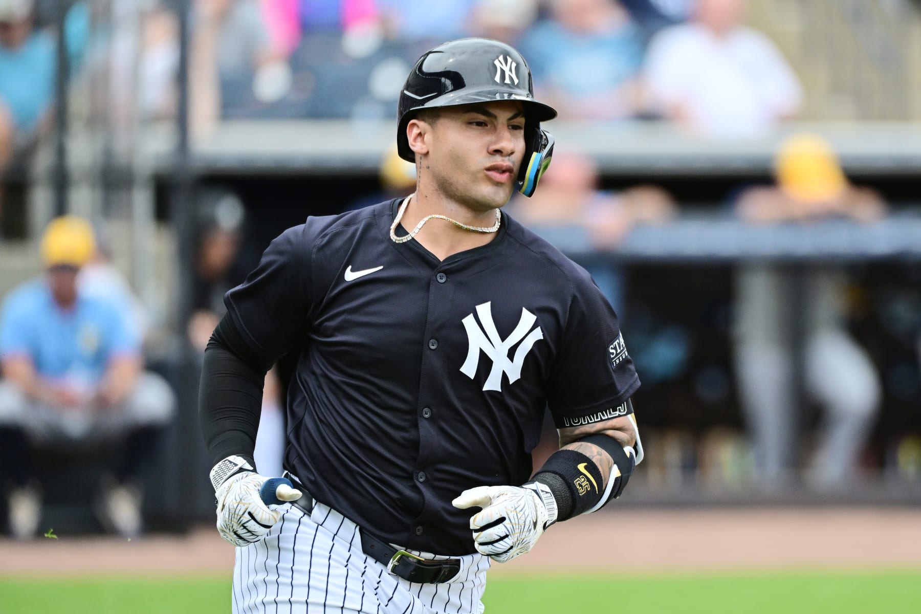 TAMPA, FLORIDA - MARCH 06: Gleyber Torres #25 of the New York Yankees runs to first after hitting a single in the fourth inning against the Tampa Bay Rays during a 2024 Grapefruit League Spring Training game at George M. Steinbrenner Field on March 06, 2024 in Tampa, Florida. (Photo by Julio Aguilar/Getty Images)