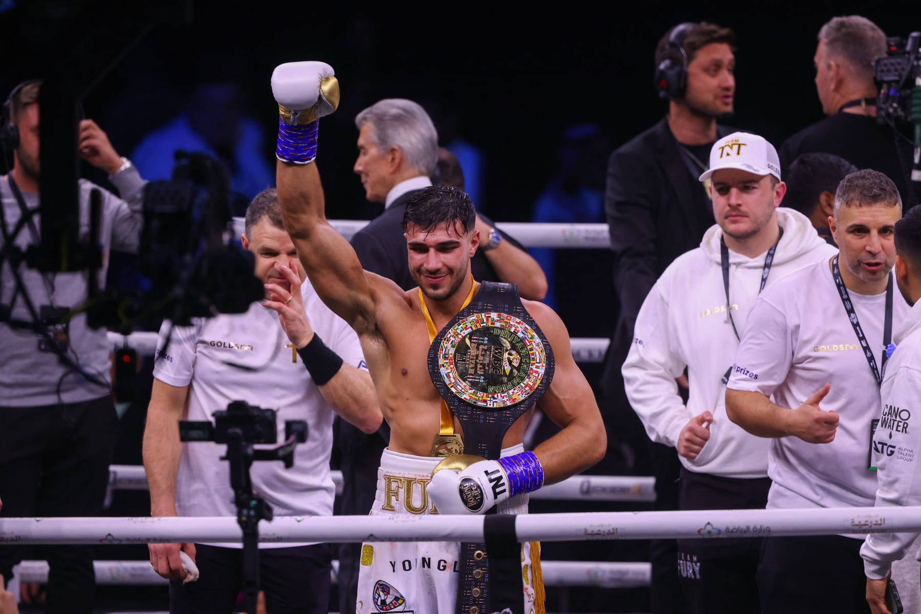 British reality TV star Tommy Fury (C) celebrates after he won by split decision against US YouTuber Jake Paul in a boxing match held at Diriyah in Riyadh, Saudi Arabia on February 27, 2023. (Photo by Fayez Nureldine / AFP) (Photo by FAYEZ NURELDINE/AFP via Getty Images)