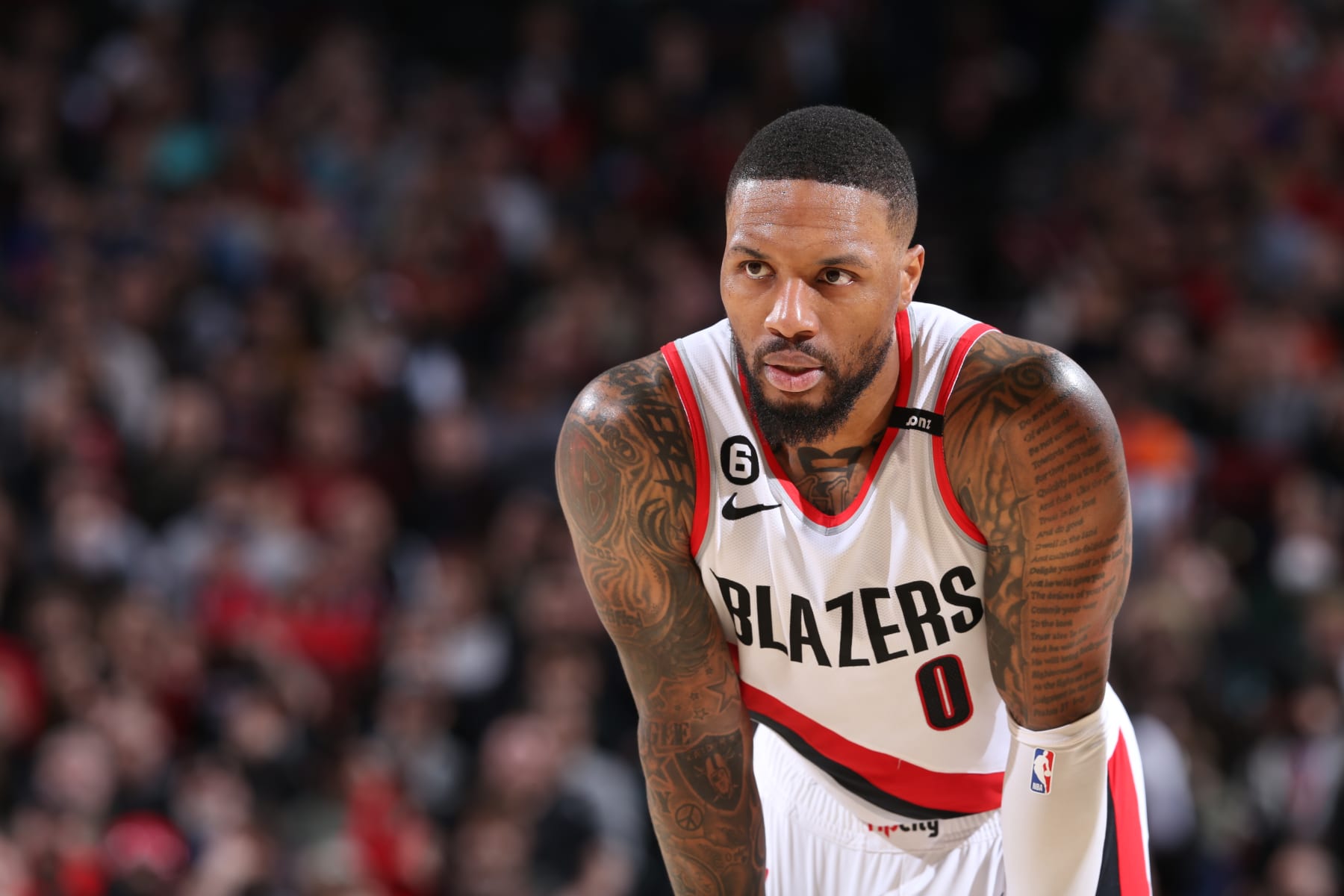 PORTLAND, OR - MARCH 14:  Damian Lillard #0 of the Portland Trail Blazers looks on during the game on March 14, 2023 at the Moda Center Arena in Portland, Oregon. NOTE TO USER: User expressly acknowledges and agrees that, by downloading and or using this photograph, user is consenting to the terms and conditions of the Getty Images License Agreement. Mandatory Copyright Notice: Copyright 2023 NBAE (Photo by Sam Forencich/NBAE via Getty Images)