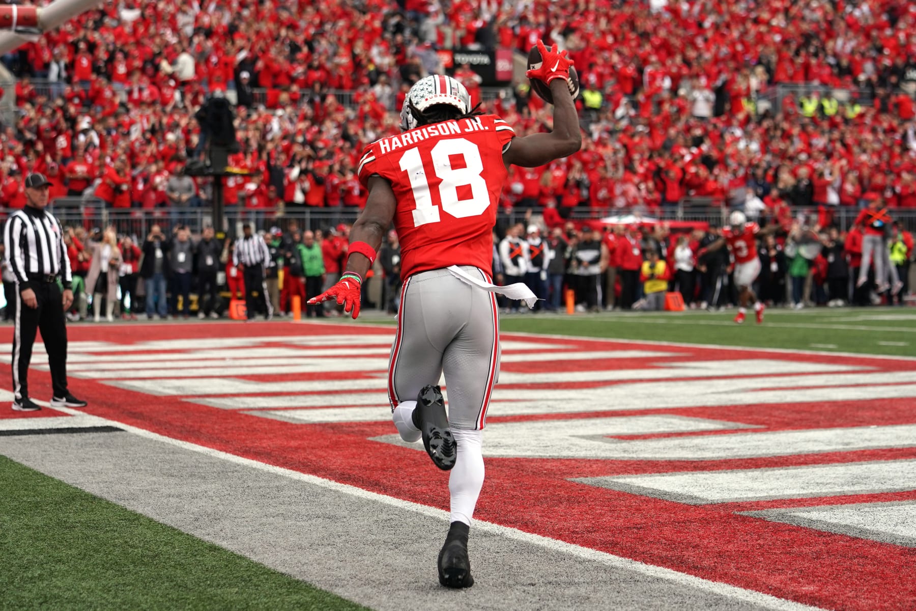 COLUMBUS, OH - OCTOBER 21: Wide receiver Marvin Harrison Jr. #18 of the Ohio State Buckeyes celebrates a touchdown during the game against the Penn State Nittany Lionsat Ohio Stadium in Columbus, Ohio on October 21, 2023. (Photo by Jason Mowry/Icon Sportswire via Getty Images)