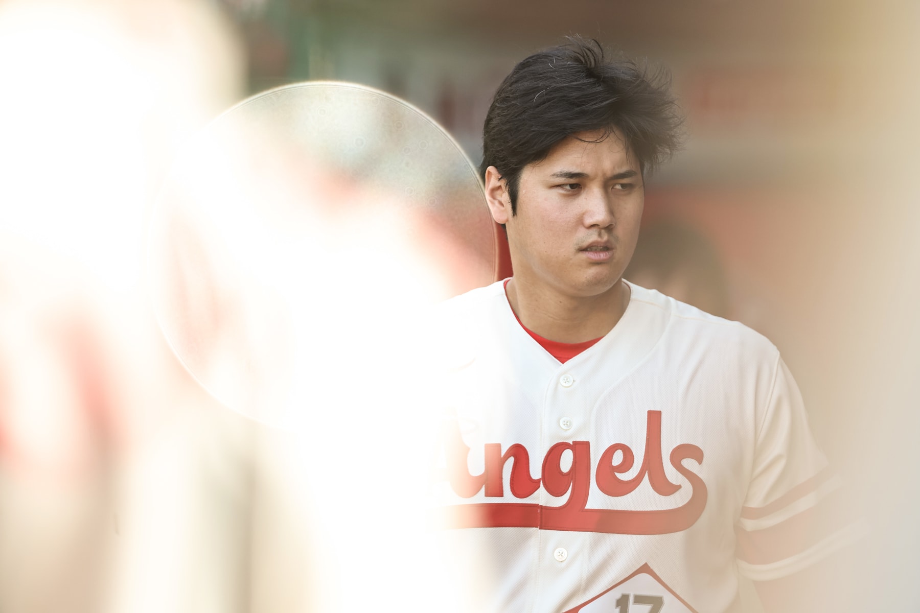 ANAHEIM, CALIFORNIA - JULY 16: Shohei Ohtani #17 of the Los Angeles Angels looks on in the dugout prior to a game against the Houston Astros at Angel Stadium of Anaheim on July 16, 2023 in Anaheim, California. (Photo by Michael Owens/Getty Images)