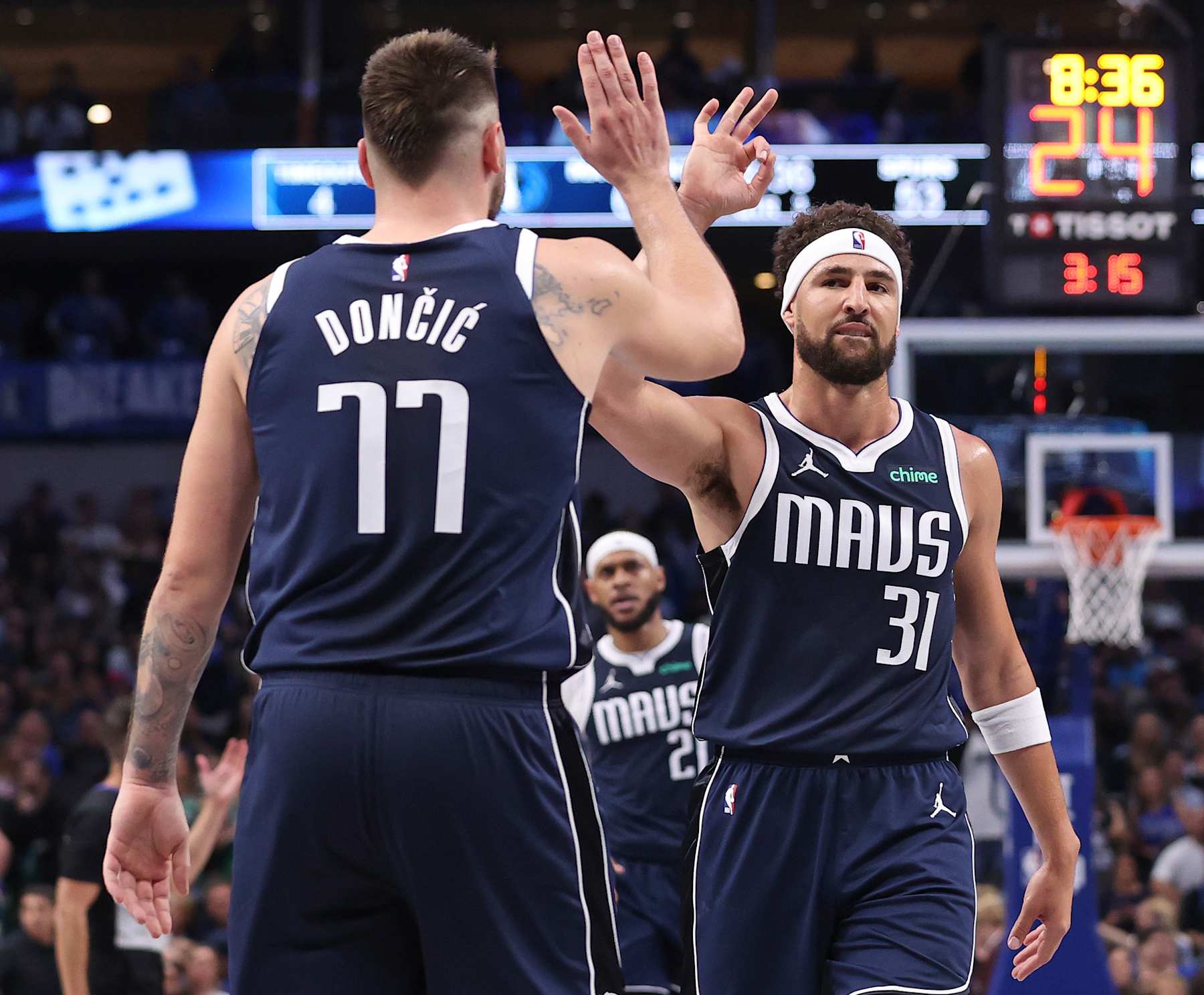 DALLAS, TX - OCTOBER 24: Luka Doncic #77 and Klay Thompson #31 of the Dallas Mavericks high five during the game against the San Antonio Spurs on October 24, 2024 at American Airlines Center in Dallas, Texas. NOTE TO USER: User expressly acknowledges and agrees that, by downloading and or using this photograph, User is consenting to the terms and conditions of the Getty Images License Agreement. Mandatory Copyright Notice: Copyright 2024 NBAE (Photo by Joe Murphy/NBAE via Getty Images)