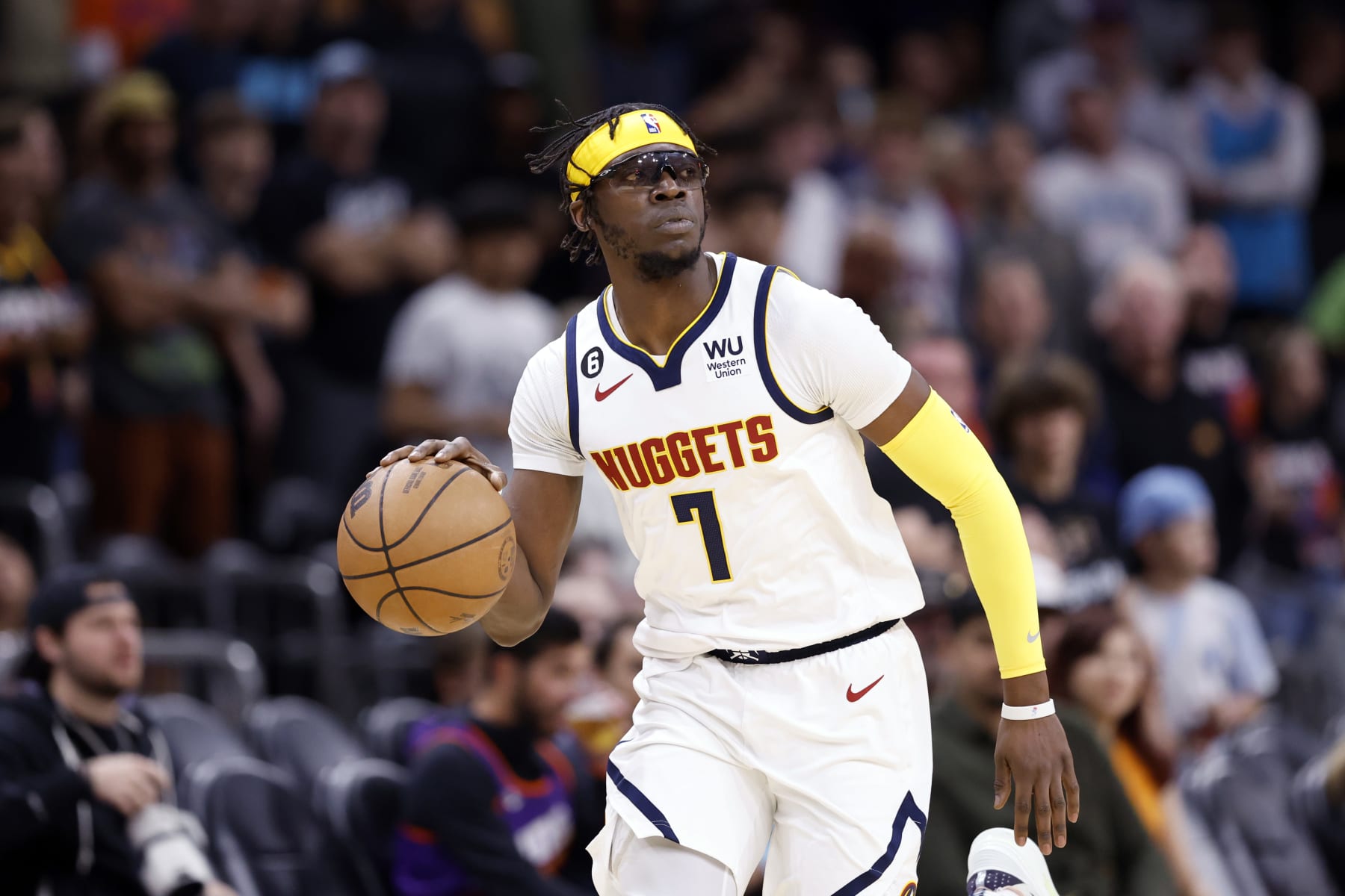 PHOENIX, ARIZONA - APRIL 06: Reggie Jackson #7 of the Denver Nuggets dribbles the ball during the game against the Phoenix Suns at Footprint Center on April 06, 2023 in Phoenix, Arizona. The Suns beat the Nuggets 119-115. NOTE TO USER: User expressly acknowledges and agrees that, by downloading and or using this photograph, User is consenting to the terms and conditions of the Getty Images License Agreement.  (Photo by Chris Coduto/Getty Images)
