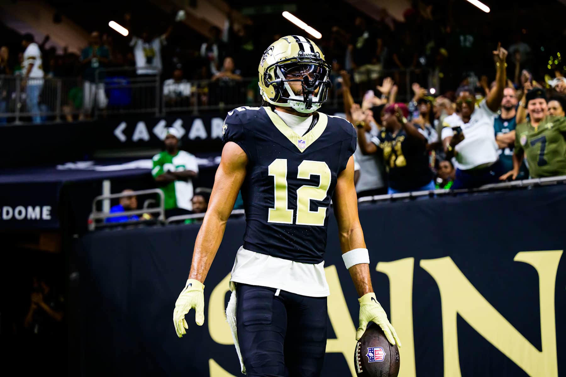 NEW ORLEANS, LOUISIANA - SEPTEMBER 22: Chris Olave #12 of the New Orleans Saints celebrates a touchdown reception against the Philadelphia Eagles during the fourth quarter at Caesars Superdome on September 22, 2024 in New Orleans, Louisiana. (Photo by Gus Stark/Getty Images)
