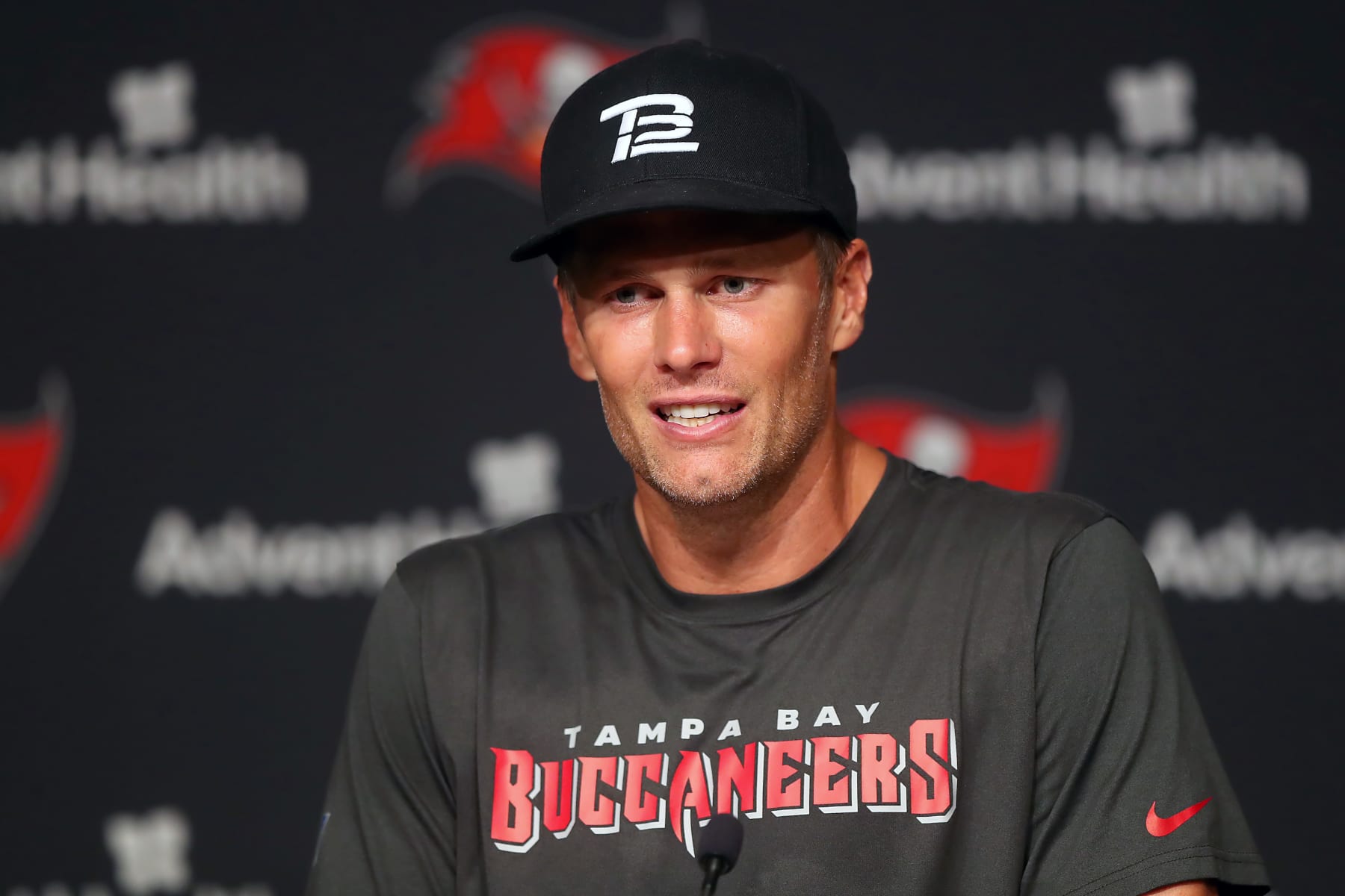 TAMPA, FL - JUN 09: Tampa Bay Buccaneers quarterback Tom Brady (12) speaks to the media after the Tampa Bay Buccaneers Minicamp on June 09, 2022 at the AdventHealth Training Center at One Buccaneer Place in Tampa, Florida. (Photo by Cliff Welch/Icon Sportswire via Getty Images)