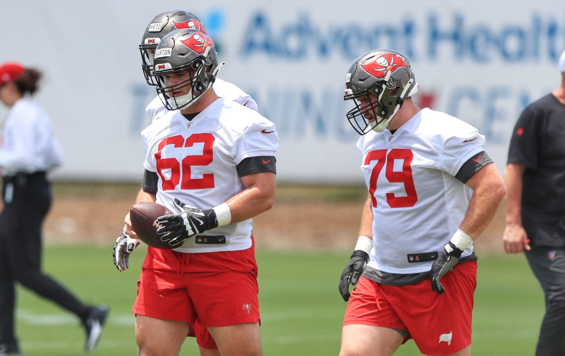 TAMPA, FL - MAY 10: Tampa Bay Buccaneers Center Graham Barton (62) and Guard Elijah Klein (79) go thru a drill during the Tampa Bay Buccaneers Rookie Minicamp on May 10, 2023 at the AdventHealth Training Center at One Buccaneer Place in Tampa, Florida. (Photo by Cliff Welch/Icon Sportswire via Getty Images)