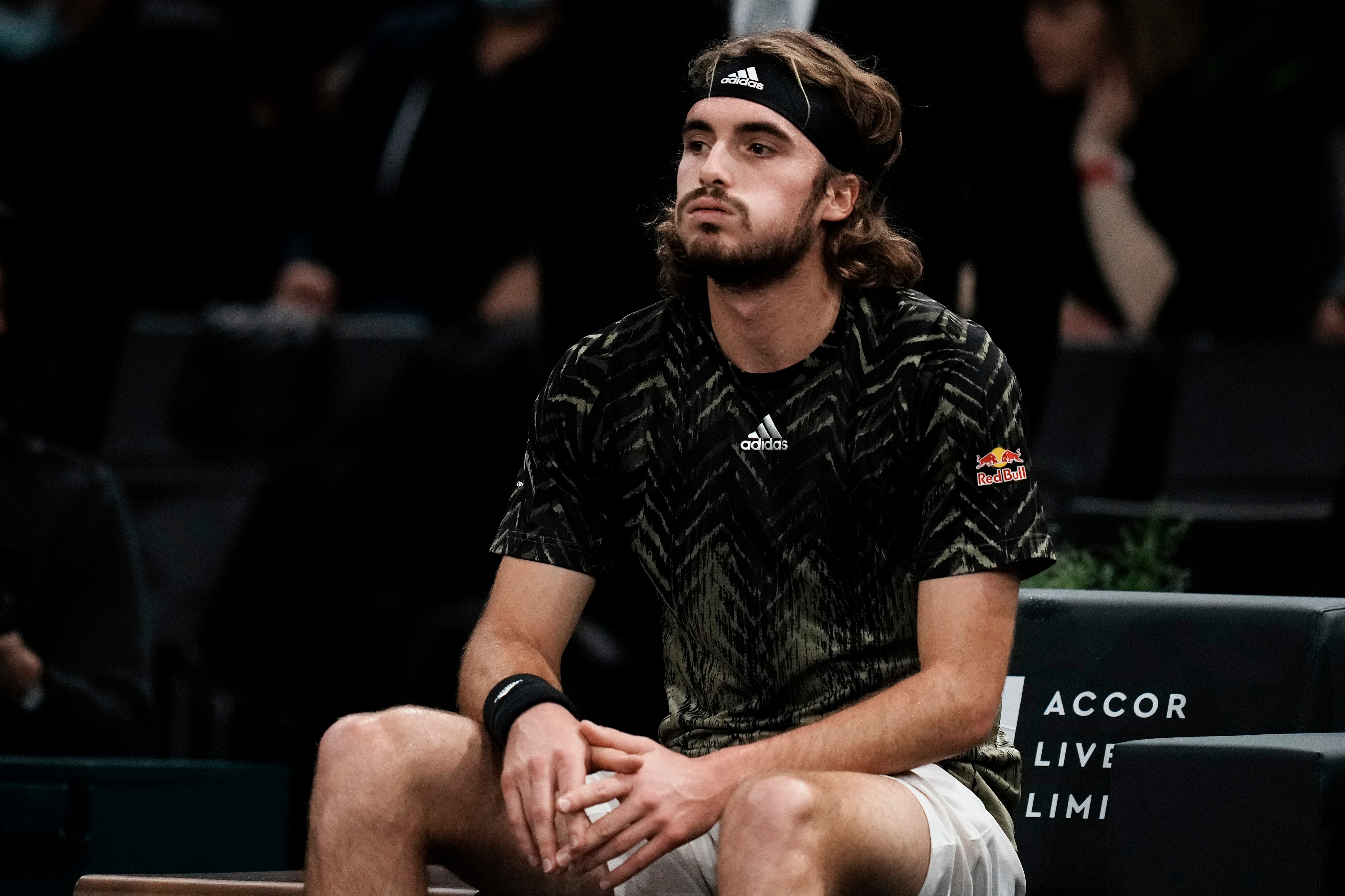 Stefanos Tsitsipas of Greece reacts prior to his withdrawal of the tournament of the Paris Masters tennis tournament at the Bercy Arena in Paris, Wednesday, Nov. 3, 2021. (AP Photo/Thibault Camus)