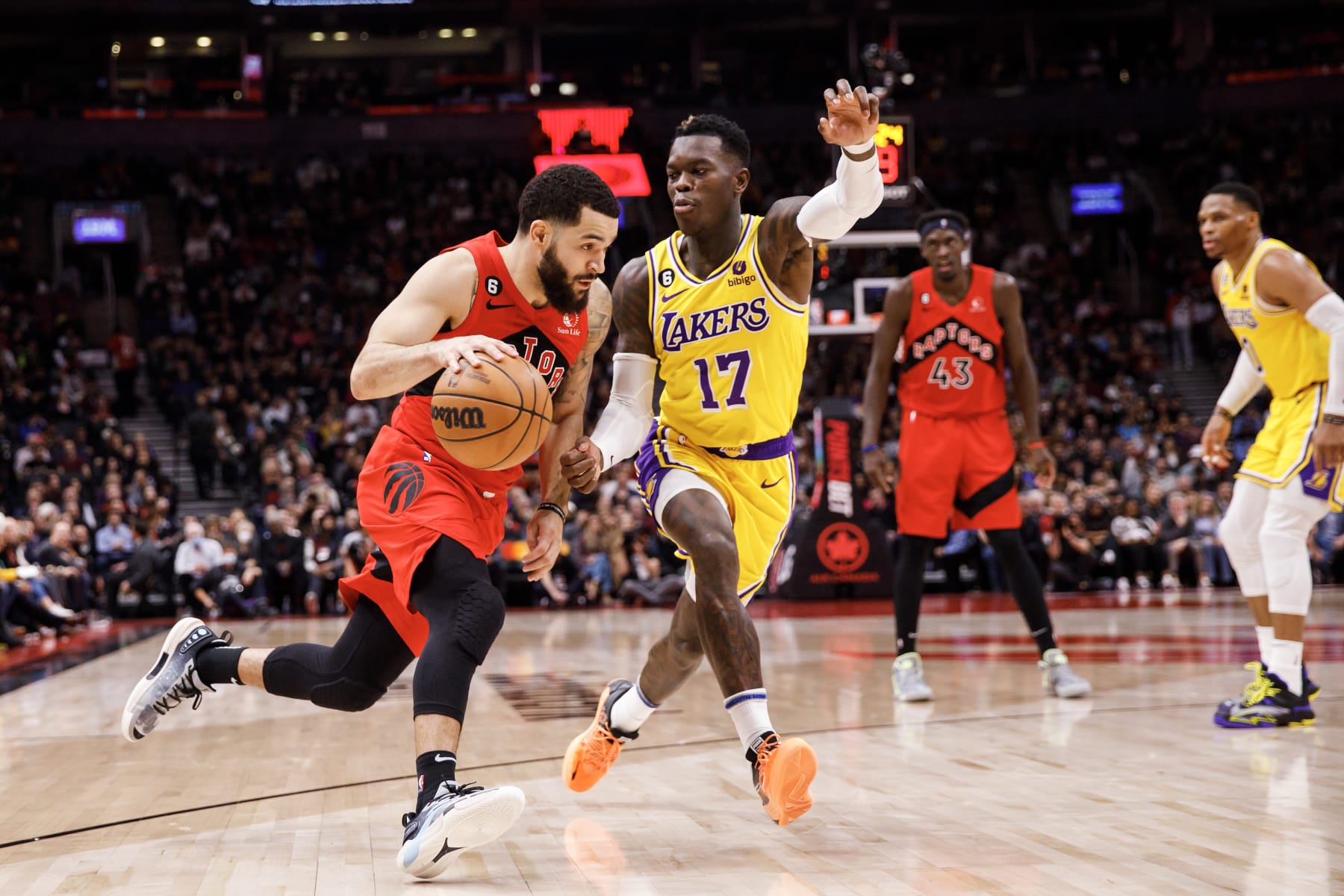 TORONTO, ON - DECEMBER 07: Fred VanVleet #23 of the Toronto Raptors dribbles against Dennis Schroder #17 of the Los Angeles Lakers during the first half of their NBA game at Scotiabank Arena on December 7, 2022 in Toronto, Canada. NOTE TO USER: User expressly acknowledges and agrees that, by downloading and or using this photograph, User is consenting to the terms and conditions of the Getty Images License Agreement. (Photo by Cole Burston/Getty Images)
