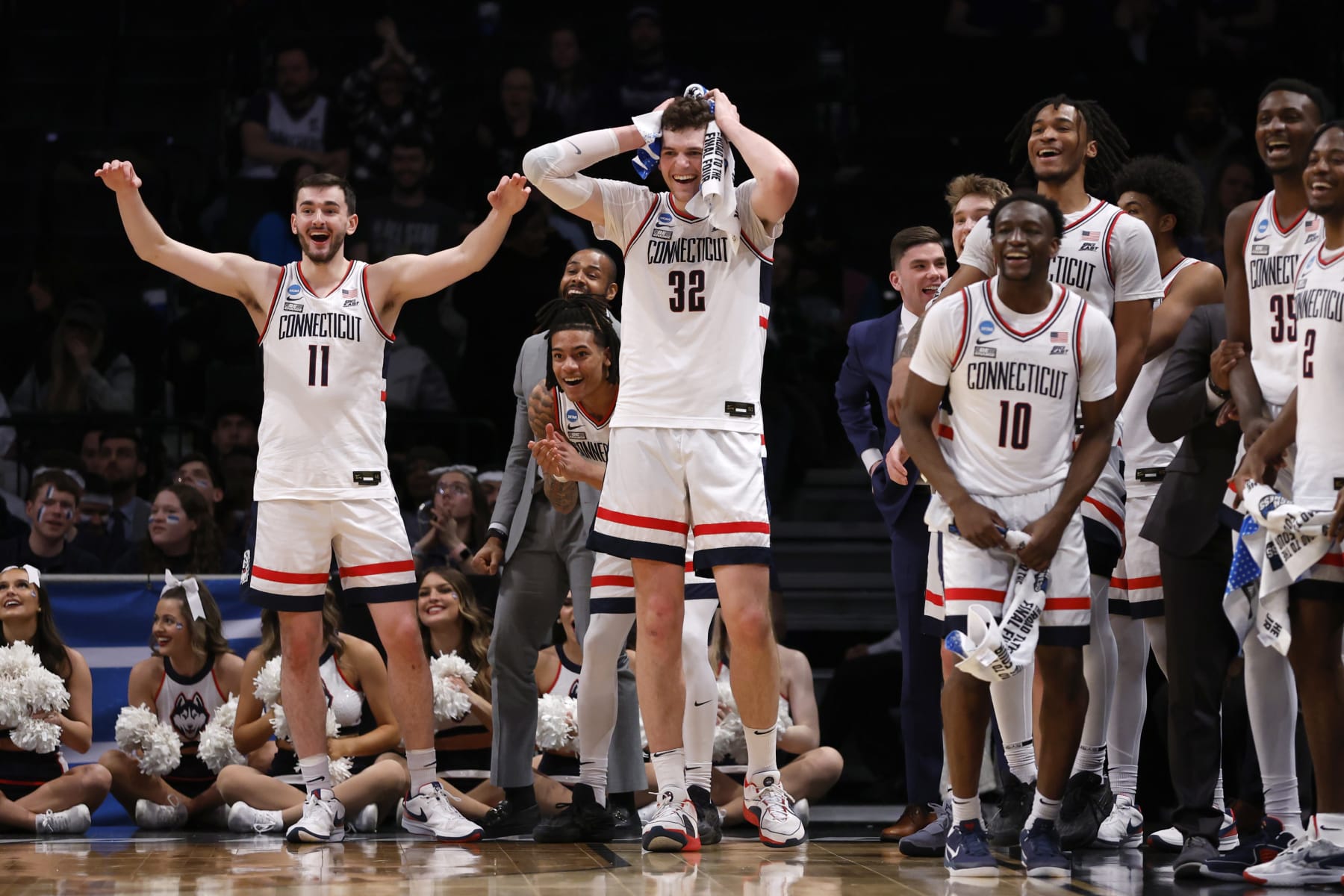 NEW YORK, NEW YORK - MARCH 24: Alex Karaban #11, Donovan Clingan #32, and Hassan Diarra #10 of the Connecticut Huskies react during the second half against the Northwestern Wildcats in the second round of the NCAA Men's Basketball Tournament at Barclays Center on March 24, 2024 in New York City. (Photo by Sarah Stier/Getty Images)