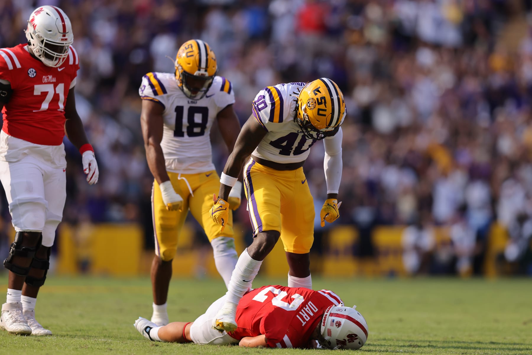 LSU's Harold Perkins Jr. reacts after sacking Ole Miss' Jaxson Dart
