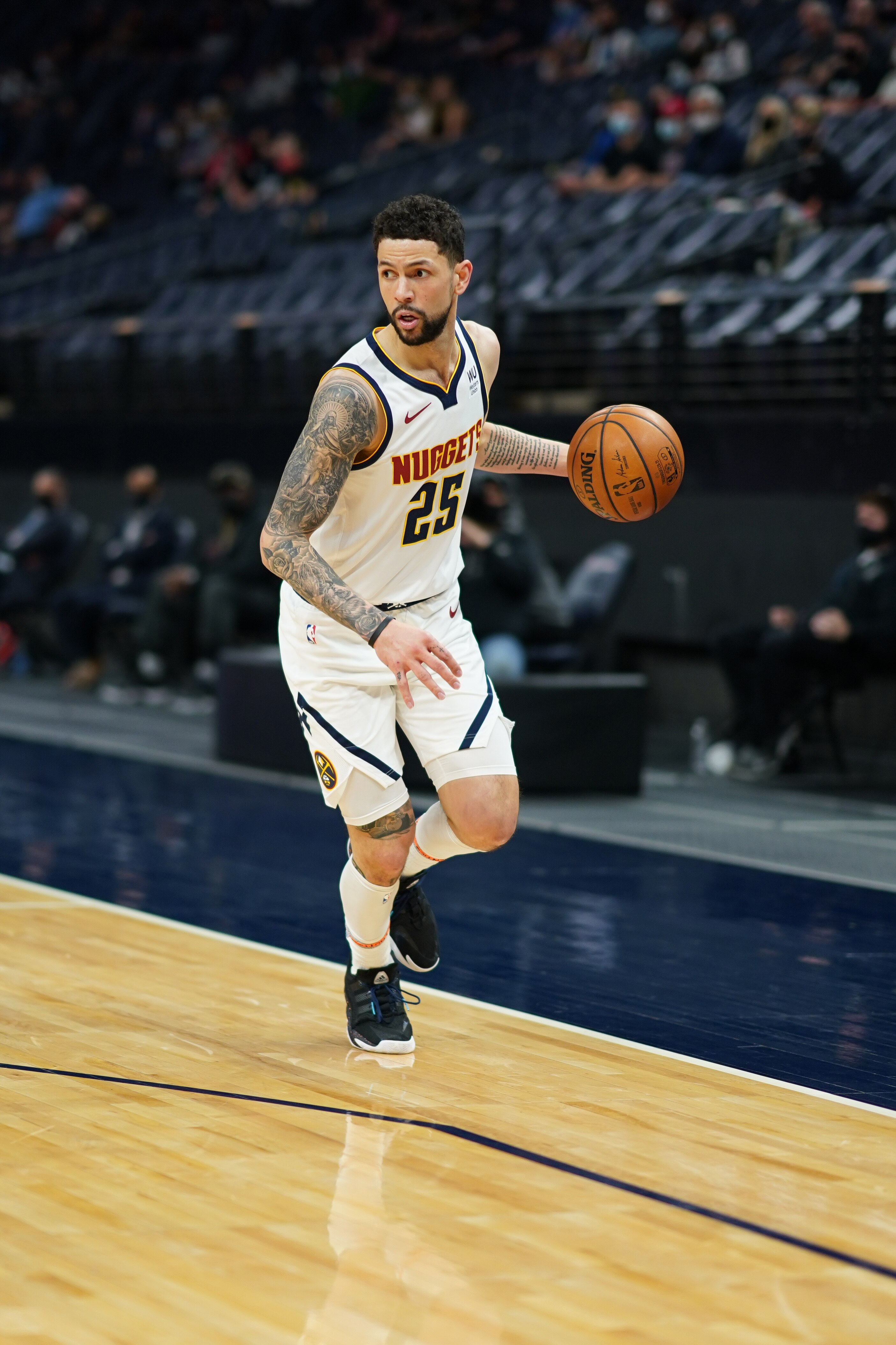 MINNEAPOLIS, MN -  MAY 13:   Austin Rivers #25 of the Denver Nuggets handles the ball against the Minnesota Timberwolves on May 13, 2021 at Target Center in Minneapolis, Minnesota. NOTE TO USER: User expressly acknowledges and agrees that, by downloading and or using this Photograph, user is consenting to the terms and conditions of the Getty Images License Agreement. Mandatory Copyright Notice: Copyright 2021 NBAE (Photo by Jordan Johnson/NBAE via Getty Images)