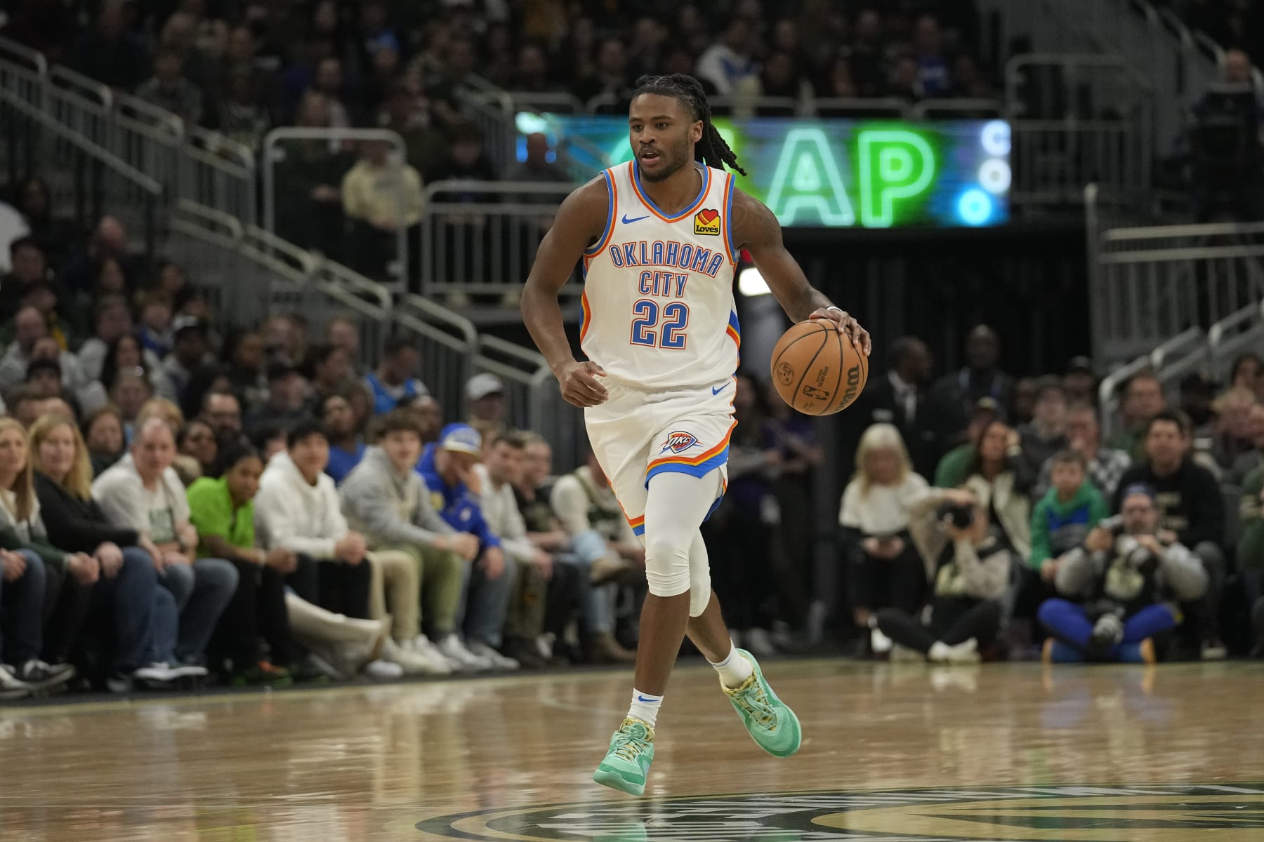 MILWAUKEE, WISCONSIN - MARCH 24: Cason Wallace #22 of the Oklahoma City Thunder dribbles the ball during the first half against the Milwaukee Bucks at Fiserv Forum on March 24, 2024 in Milwaukee, Wisconsin. NOTE TO USER: User expressly acknowledges and agrees that, by downloading and or using this photograph, User is consenting to the terms and conditions of the Getty Images License Agreement. (Photo by Patrick McDermott/Getty Images)