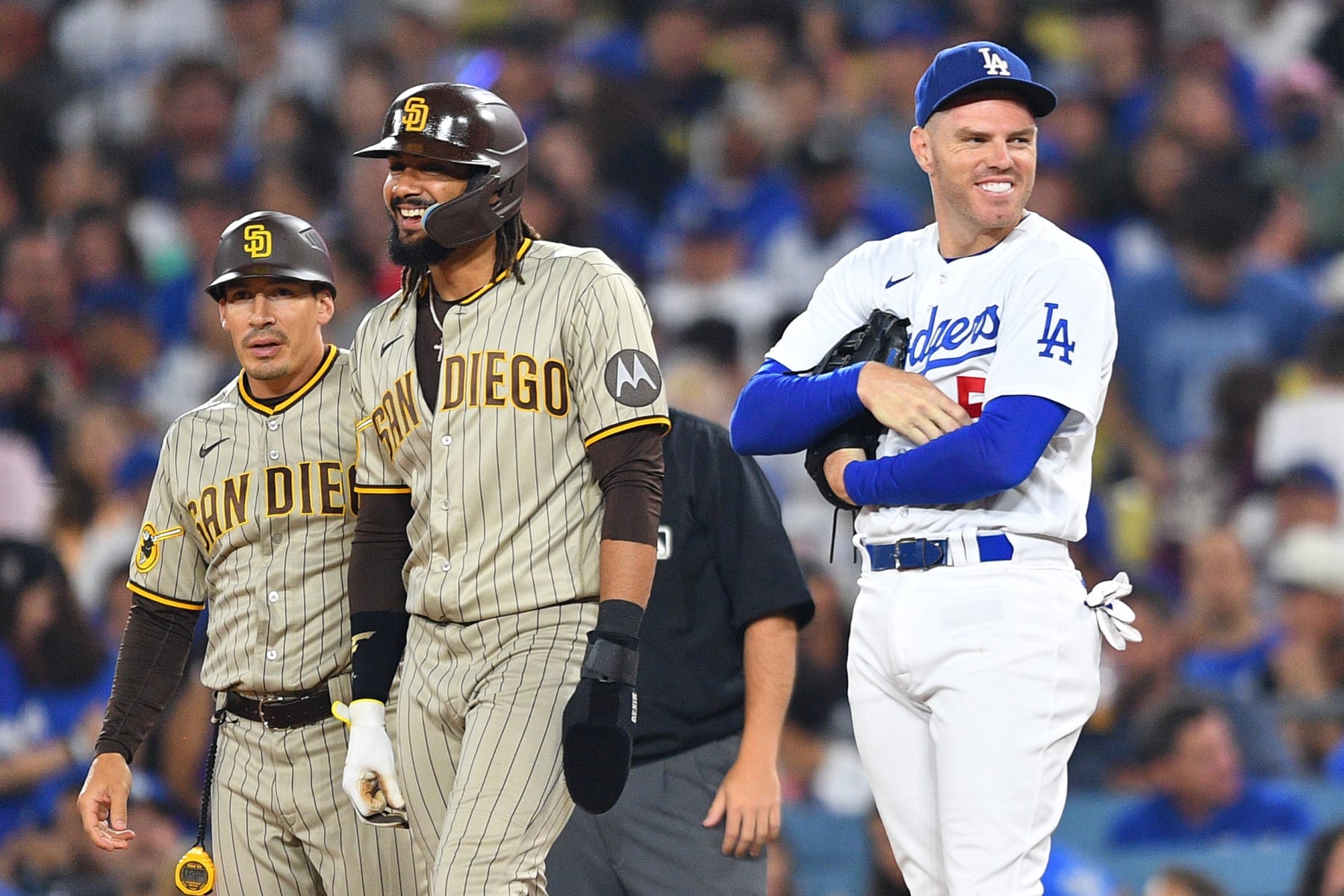 LOS ANGELES, CA - SEPTEMBER 13: San Diego Padres right fielder Fernando Tatis Jr. (23) looks on with Los Angeles Dodgers first baseman Freddie Freeman (5) during the MLB game between the San Diego Padres and the Los Angeles Dodgers on September 13, 2023 at Dodger Stadium in Los Angeles, CA. (Photo by Brian Rothmuller/Icon Sportswire via Getty Images)