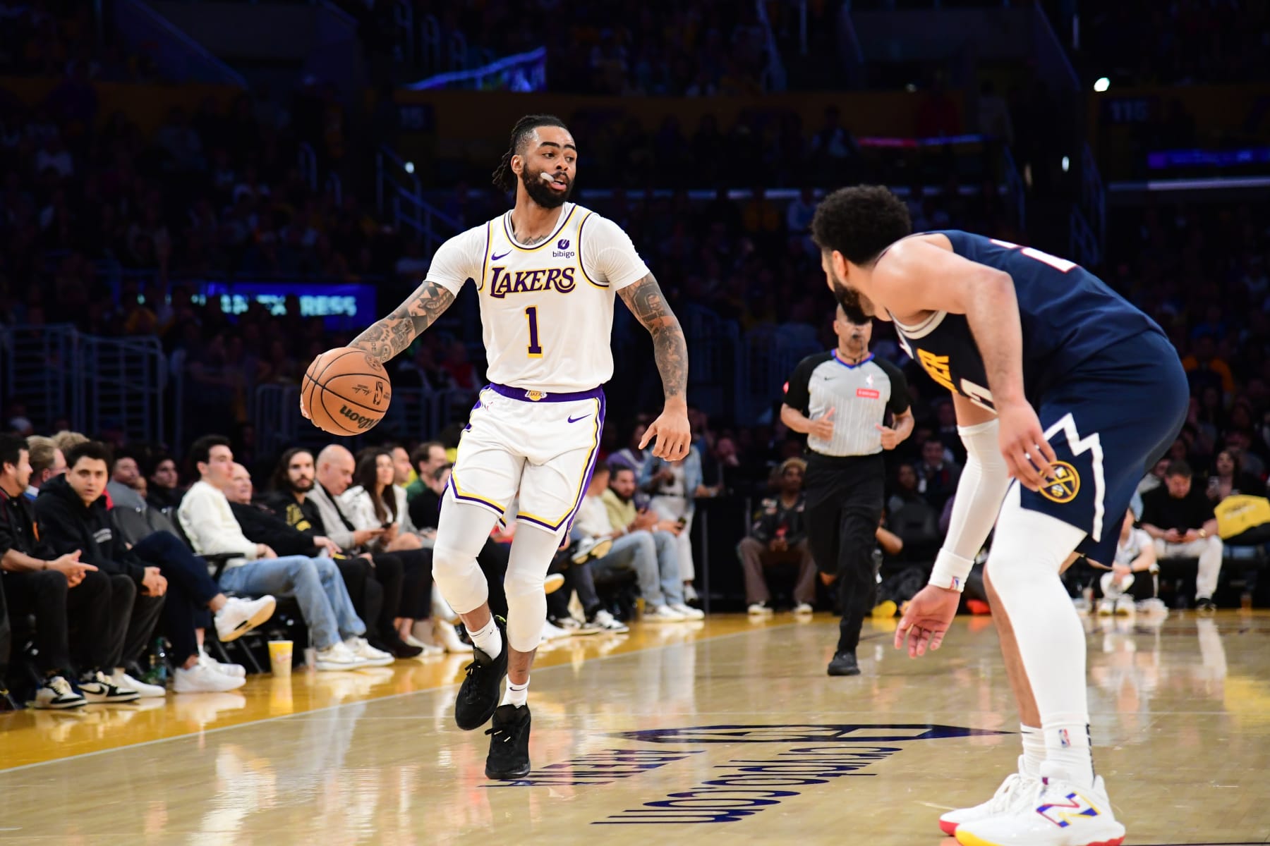 LOS ANGELES, CA - APRIL 27: D'Angelo Russell #1 of the Los Angeles Lakers dribbles the ball during the game against the Denver Nuggets during Round 1 Game 4 of the 2024 NBA Playoffs on April 27, 2024 at Crypto.Com Arena in Los Angeles, California. NOTE TO USER: User expressly acknowledges and agrees that, by downloading and/or using this Photograph, user is consenting to the terms and conditions of the Getty Images License Agreement. Mandatory Copyright Notice: Copyright 2024 NBAE (Photo by Adam Pantozzi/NBAE via Getty Images)