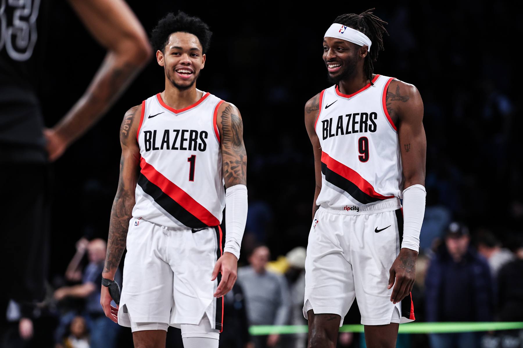 NEW YORK, NEW YORK - JANUARY 07: Anfernee Simons #1 and Jerami Grant #9 of the Portland Trail Blazers celebrate after defeating the Brooklyn Nets 134-127 in overtime at Barclays Center on January 07, 2024 in New York City. NOTE TO USER: User expressly acknowledges and agrees that, by downloading and or using this photograph, User is consenting to the terms and conditions of the Getty Images License Agreement. (Photo by Dustin Satloff/Getty Images)