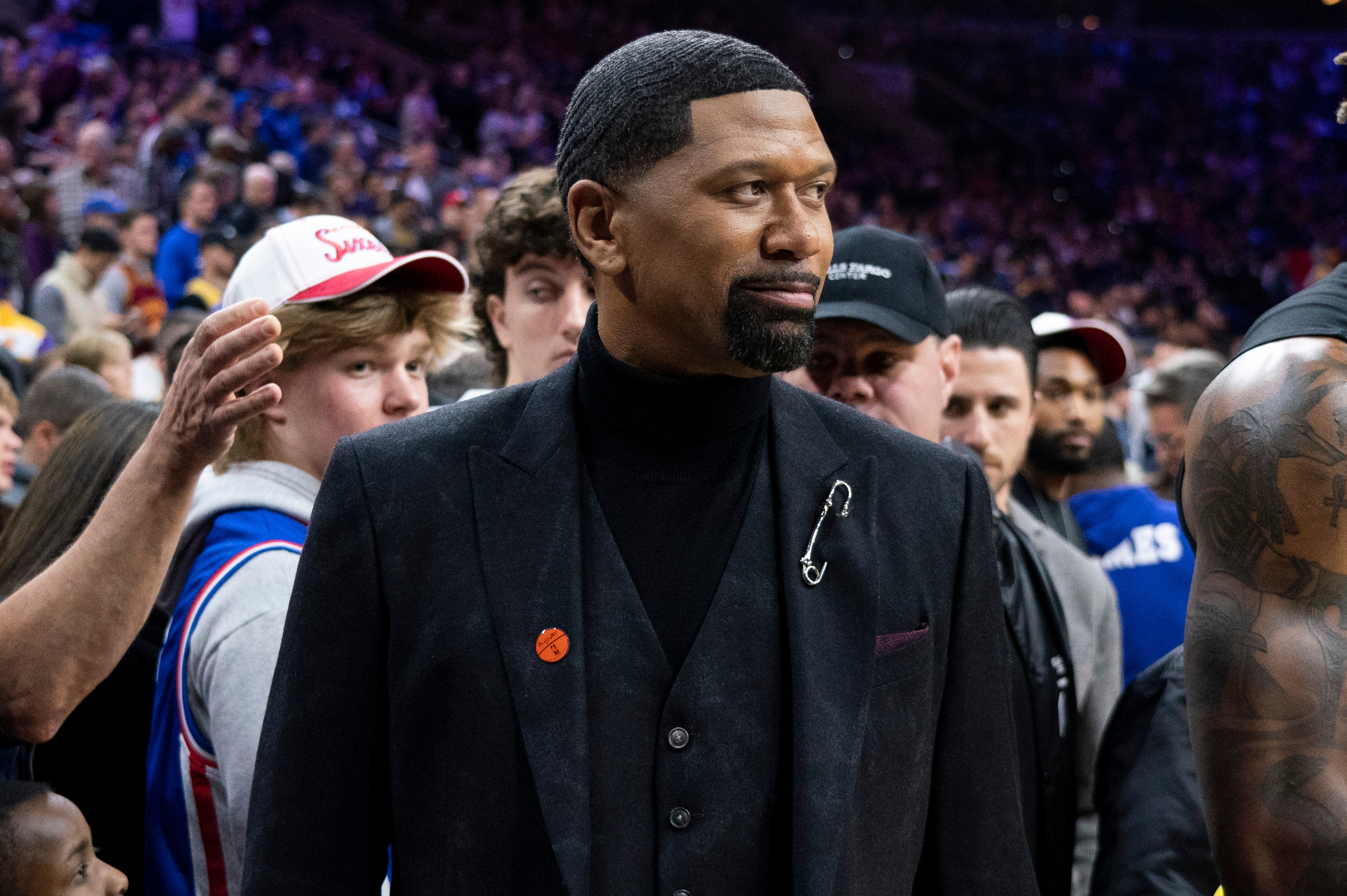 ESPN analyst Jalen Rose looks on prior to the first half of an NBA basketball game between the Los Angeles Lakers vs the Philadelphia 76ers, Saturday, Jan. 25, 2020, in Philadelphia. The 76ers won 108-91. (AP Photo/Chris Szagola)