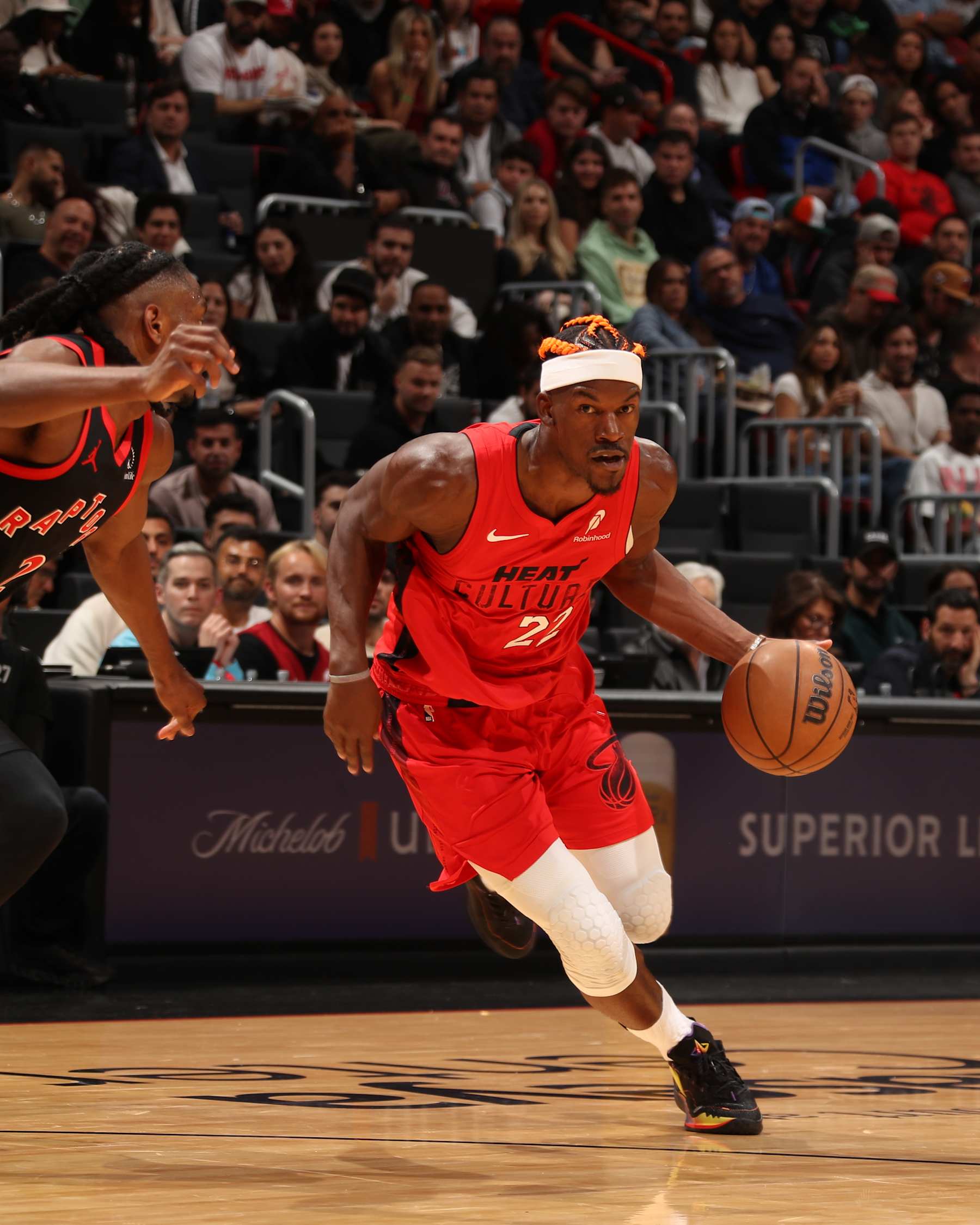 MIAMI, FL - DECEMBER 12:  Jimmy Butler #22 of the Miami Heat dribbles the ball during the game against the Toronto Raptors on December 12, 2024 at Kaseya Center in Miami, Florida. NOTE TO USER: User expressly acknowledges and agrees that, by downloading and or using this Photograph, user is consenting to the terms and conditions of the Getty Images License Agreement. Mandatory Copyright Notice: Copyright 2024 NBAE (Photo by Issac Baldizon/NBAE via Getty Images)