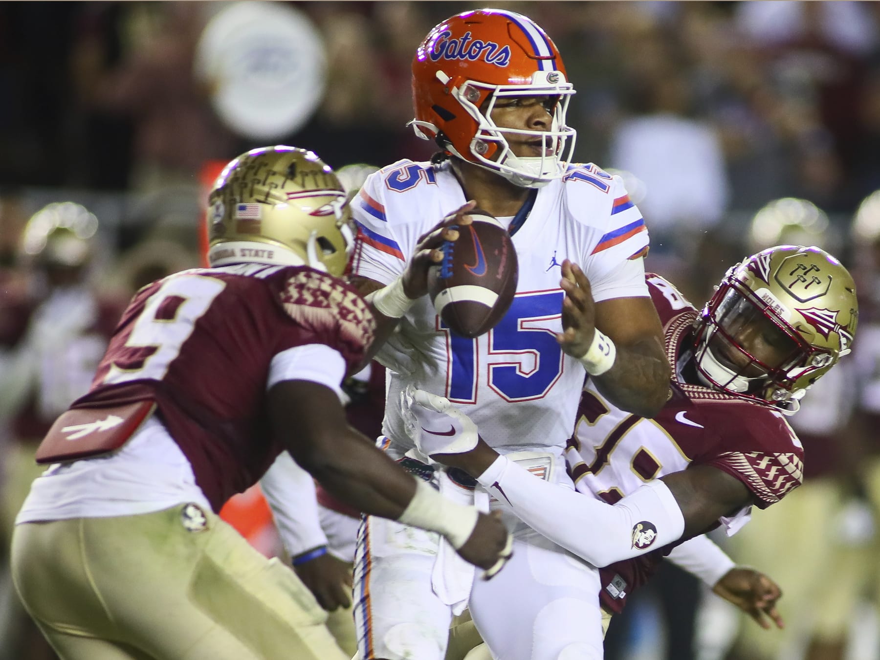 Florida State defensive end Derrick McLendon II (9) and defensive back Shyheim Brown (38) sack Florida quarterback Anthony Richardson (15) during the third quarter of an NCAA college football game Friday, Nov. 25, 2022, in Tallahassee, Fla. Florida State won 45-38. (AP Photo/Phil Sears)