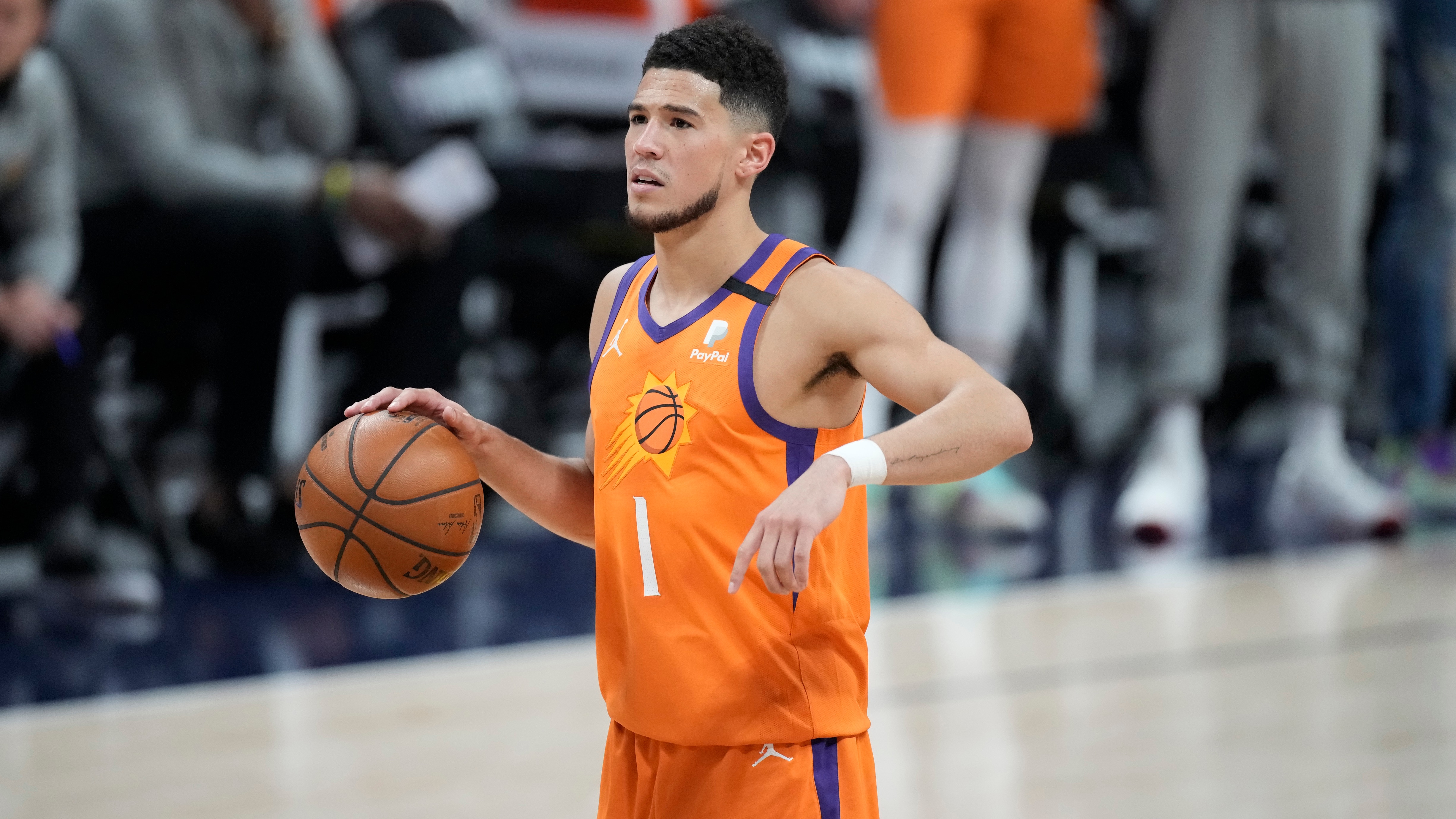 Phoenix Suns guard Devin Booker (1) in the first half of Game 3 of an NBA second-round playoff series Friday, June 11, 2021, in Denver. (AP Photo/David Zalubowski)